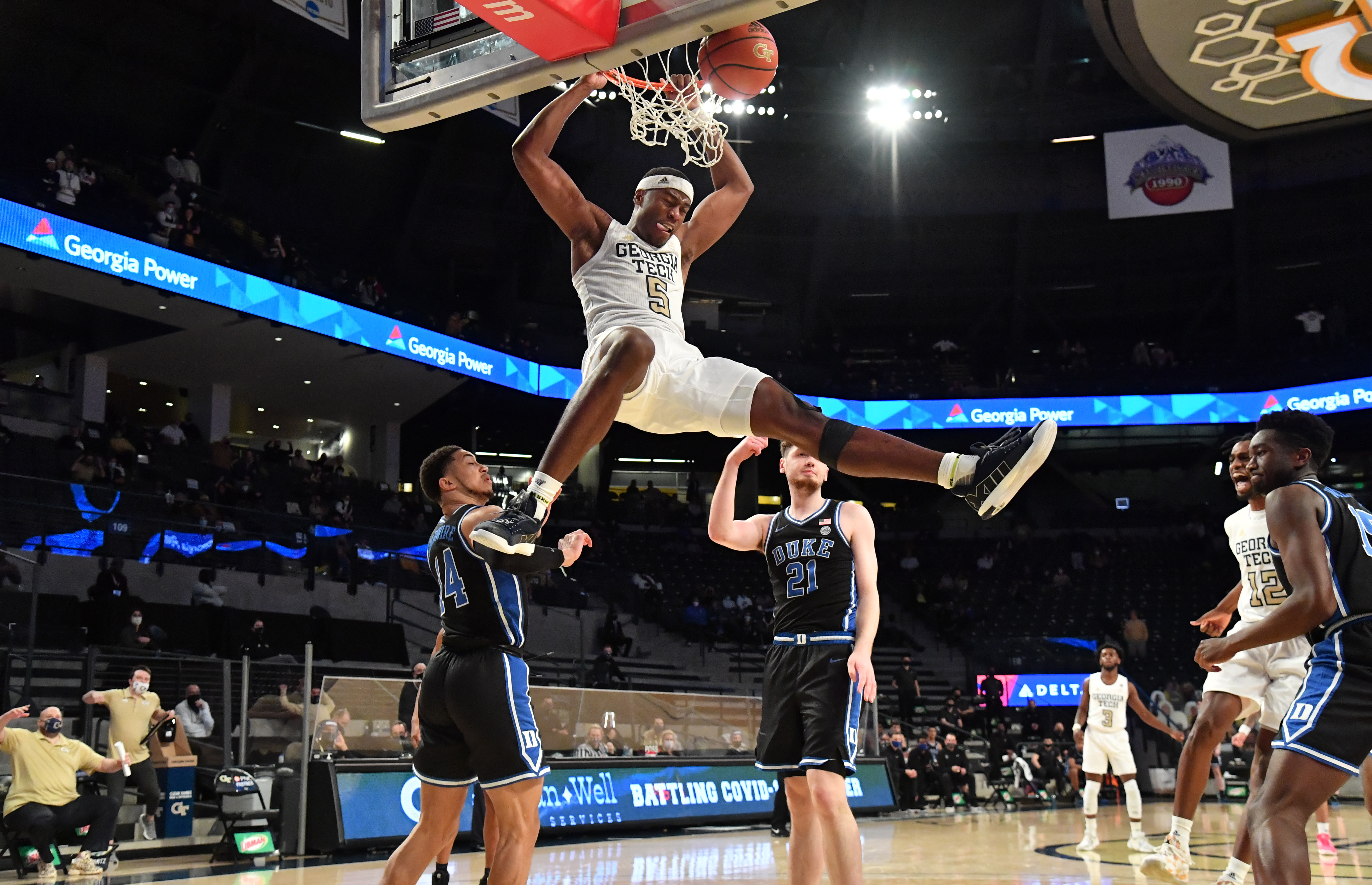Georgia Tech forward Moses Wright (5) hangs on the basket after a dunk in the second half against Duke Tuesday, March 2, 2021, at McCamish Pavilion in Atlanta. Tech won 81-77 in overtime. (Hyosub Shin / Hyosub.Shin@ajc.com)