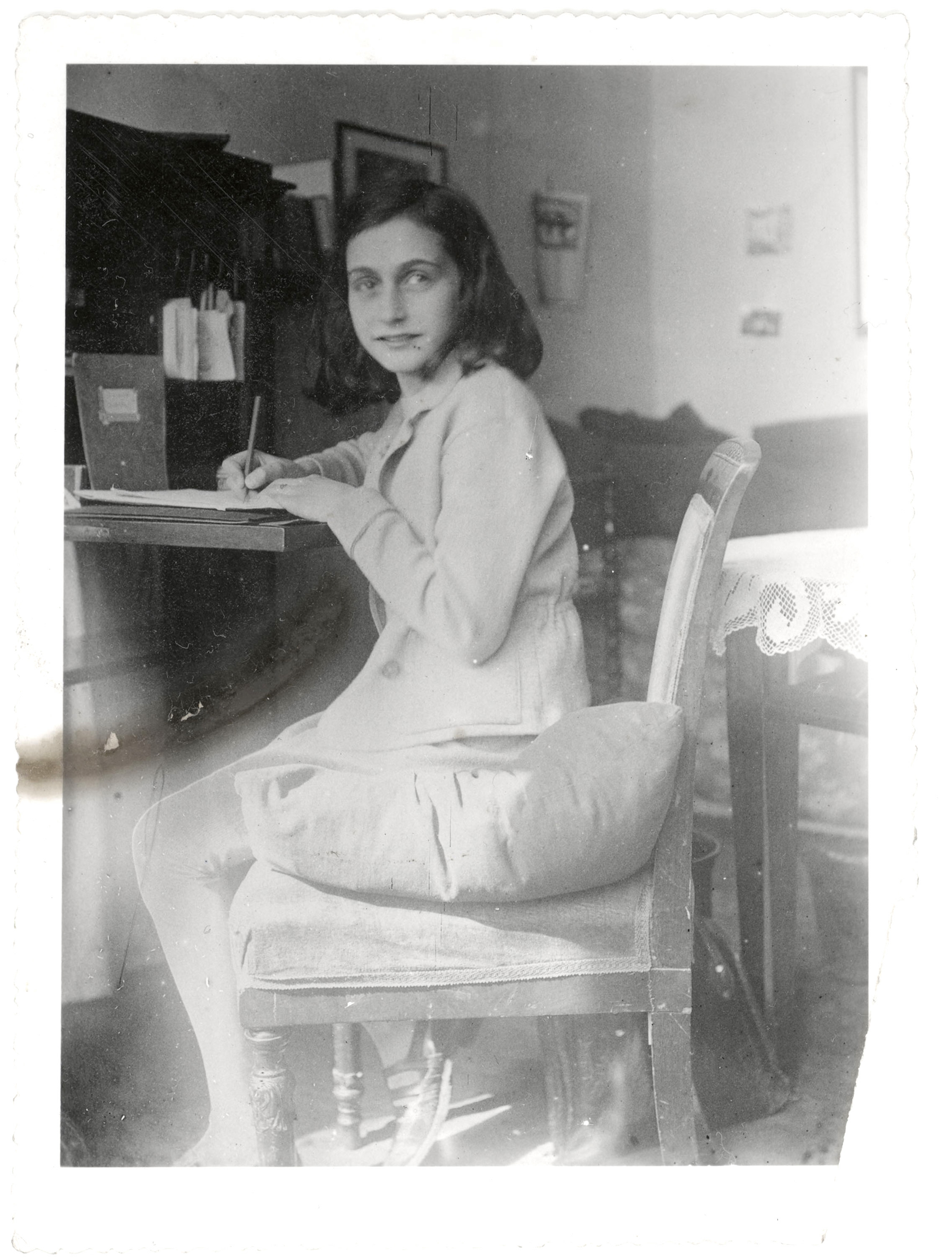 Anne Frank is writing in this April 1941 image released by Anne Frank Foundation, Basel/ The Anne Frank House, Amsterdam, on Tuesday, April 11, 2006. The exhibition, "Anne Frank: Her life in Letters" , an exhibition of letters, postcards and family notes, some of them never displayed before, opens Wednesday at the Amsterdam Historical Museum and closes Sept. 3, 2006. (AP Photo/ AFF Basel/AFS Amsterdam) NO SALES, EDITORIAL USE ONLY