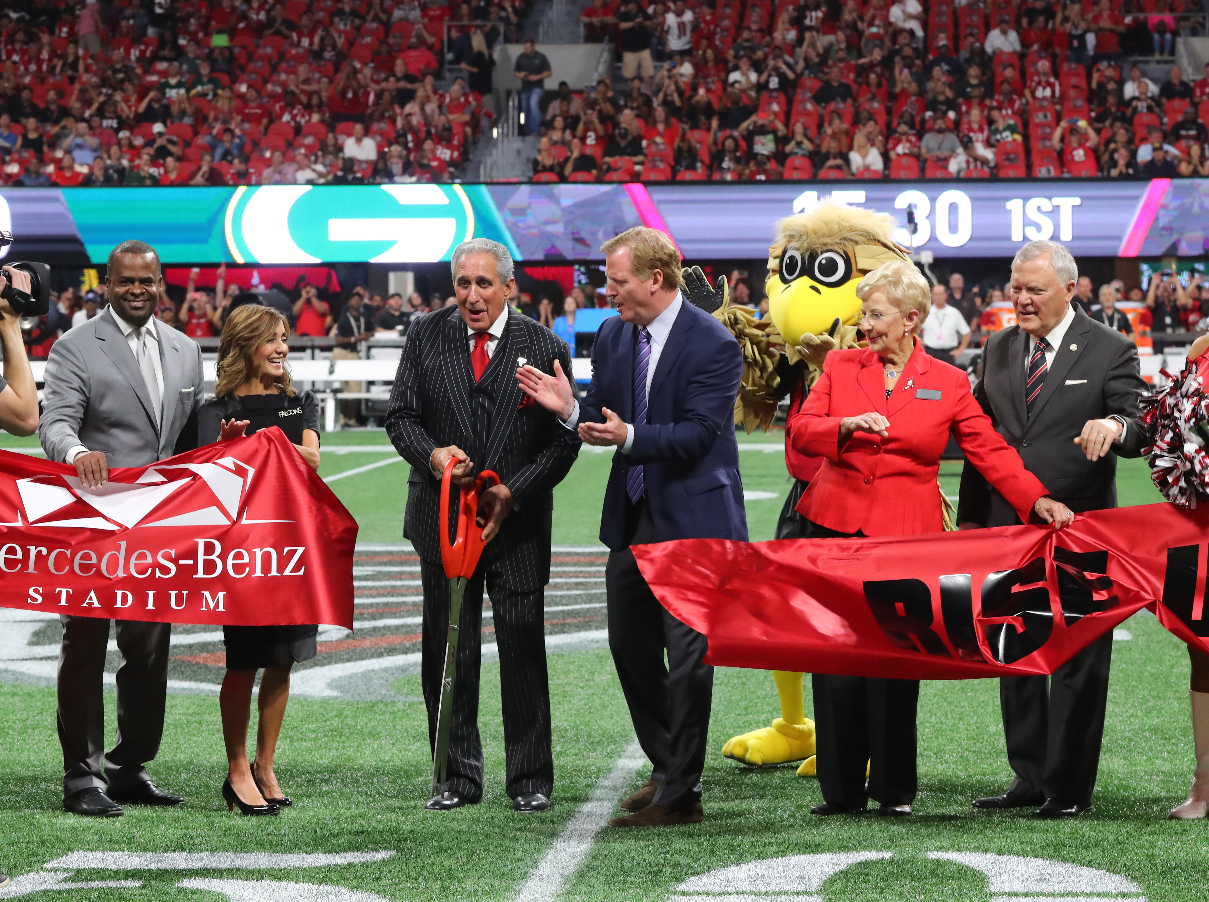 Atlanta, GA - Watched carefully by Freddie Falcon, Arthur Blank cuts the ribbon for the Falcons opener at Mercedes-Benz Stadium, with Atlanta Mayor Kasim Reed and Gov. Nathan Deal on Sept. 17. The 50-yard line is where participants in Saturday’s 5K/Walk Like MADD event will finish. CURTIS COMPTON / CCOMPTON@AJC.COM