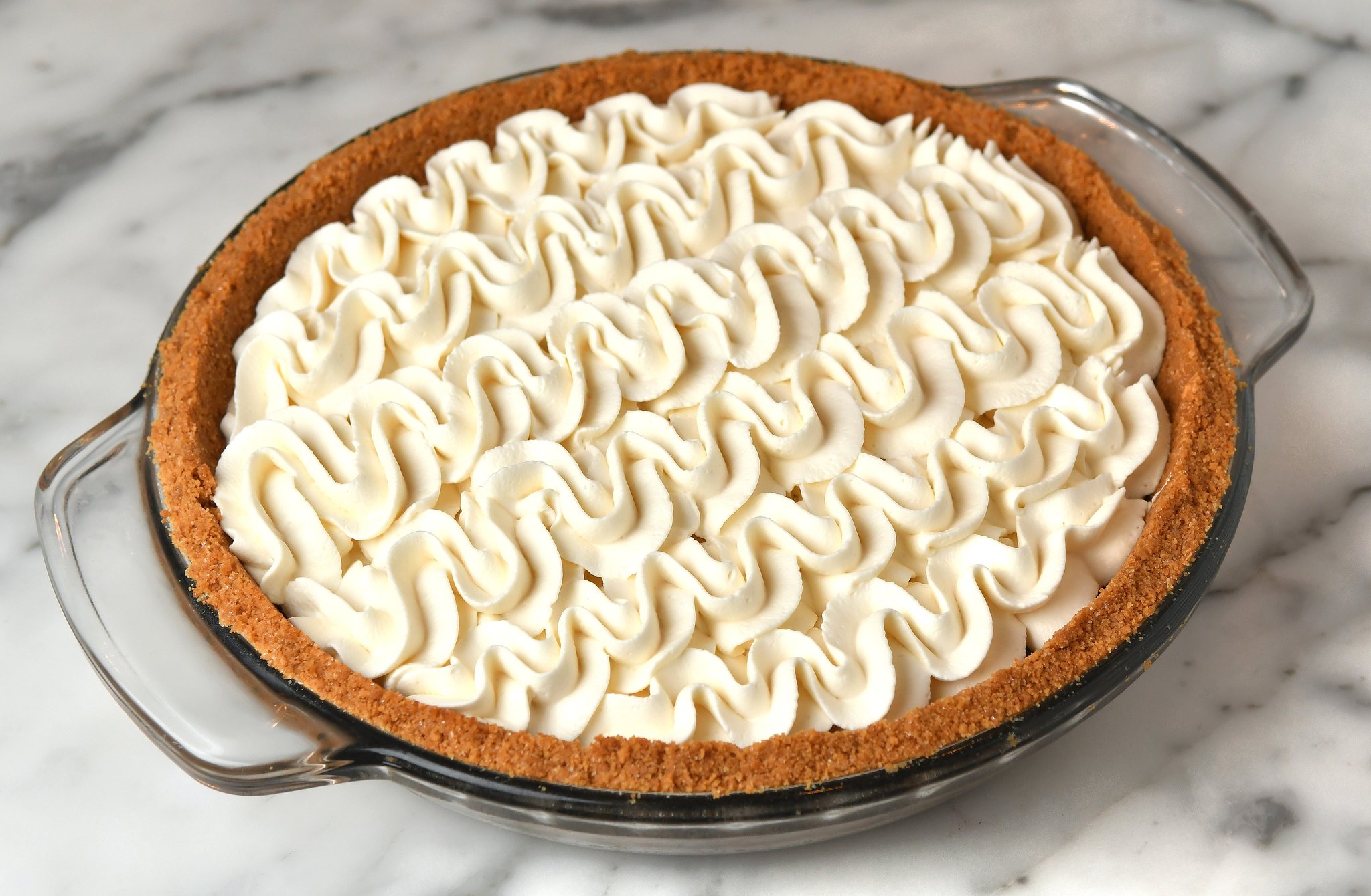 Earl Grey Latte Pie is topped with Vanilla Whipped Cream and has a strong dose of Earl Grey tea in the pie filling. STYLING BY PAUL ARGUIN AND CHRIS TAYLOR / CONTRIBUTED BY CHRIS HUNT PHOTOGRAPHY