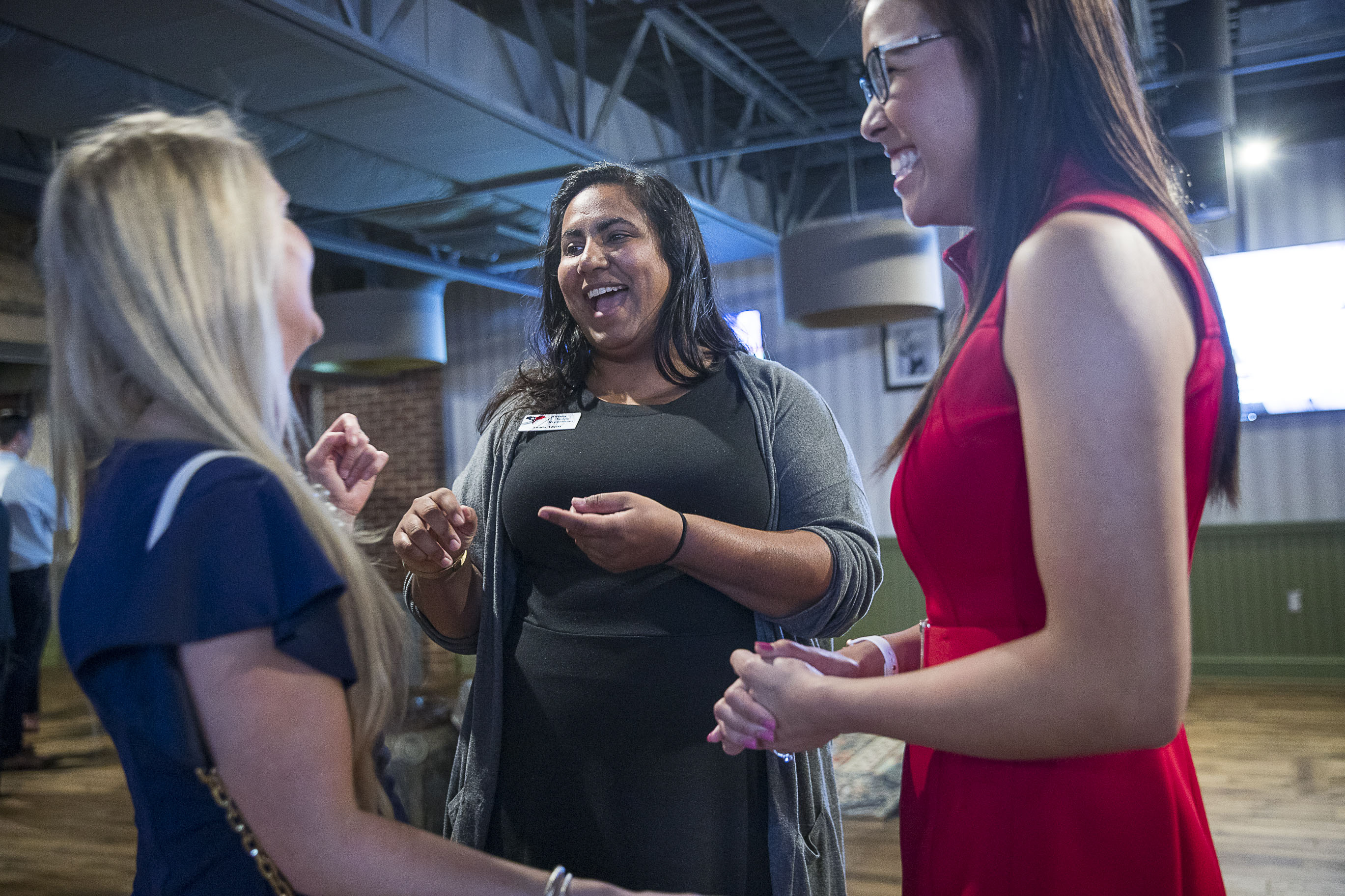 Sunita Theiss (center) shares a laugh with Ashely Quagliaroli (left) and Beatrice Shakal (right) following a panel discussion about issues affecting women in Atlanta suburbs during the Atlanta Young Republicans monthly meeting at City Tap in Atlanta, Wednesday, September 25, 2019. Sunita is the director of women's outreach for the Atlanta Young Republicans. (Alyssa Pointer/alyssa.pointer@ajc.com)