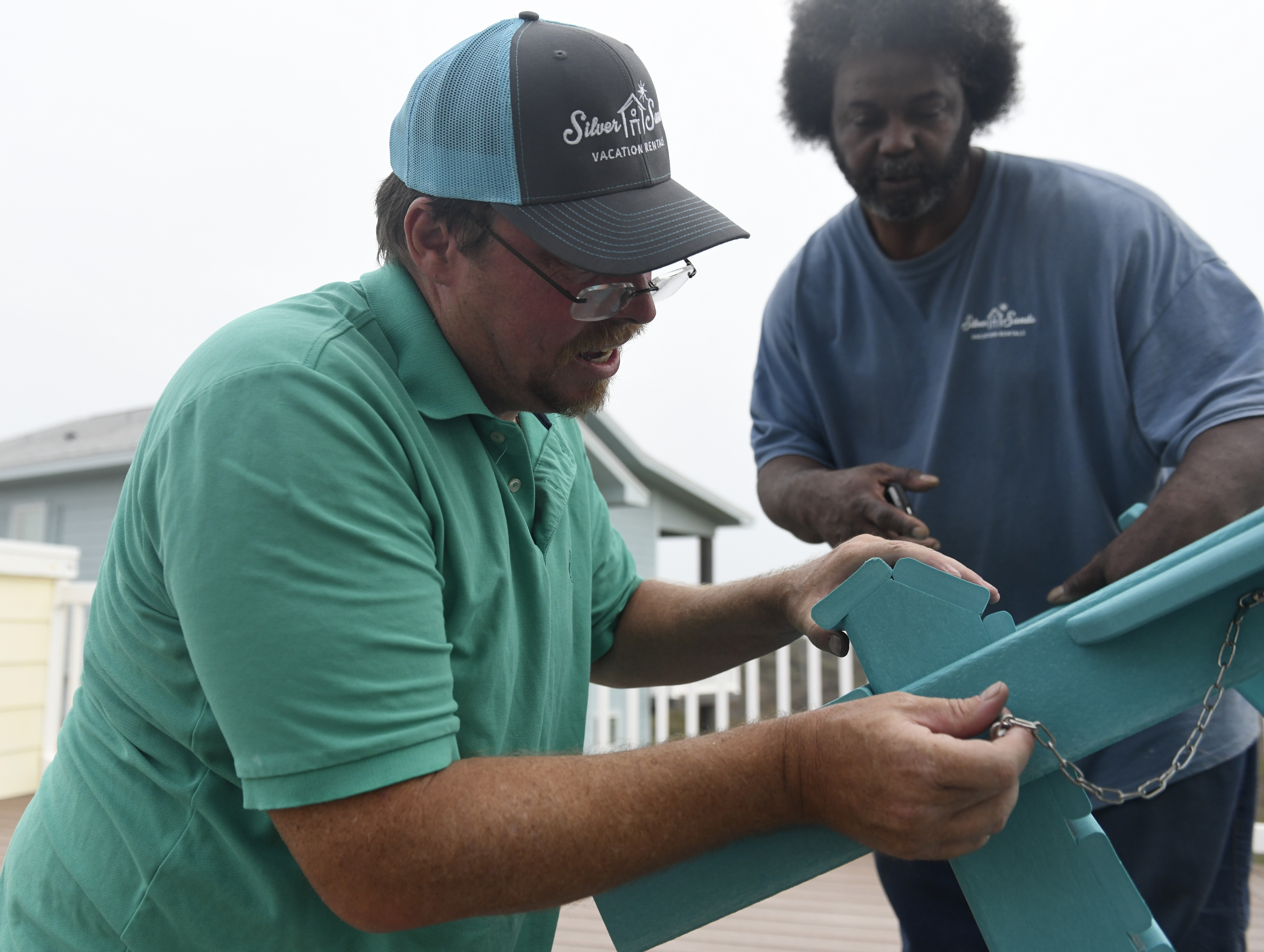 Kenny Gardiner assembles patio furniture, Monday, March 2, 2020, in Port Aransas, Texas. Gardiner is originally from Rusk, Texas, but moved to Port Aransas to find work.