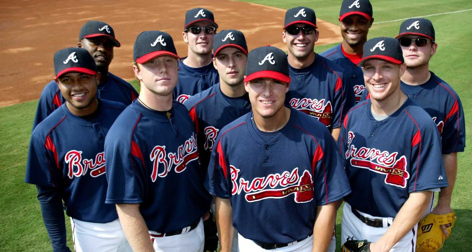 Atlanta Braves Kelly Johnson and Edgar Renteria (right) get high