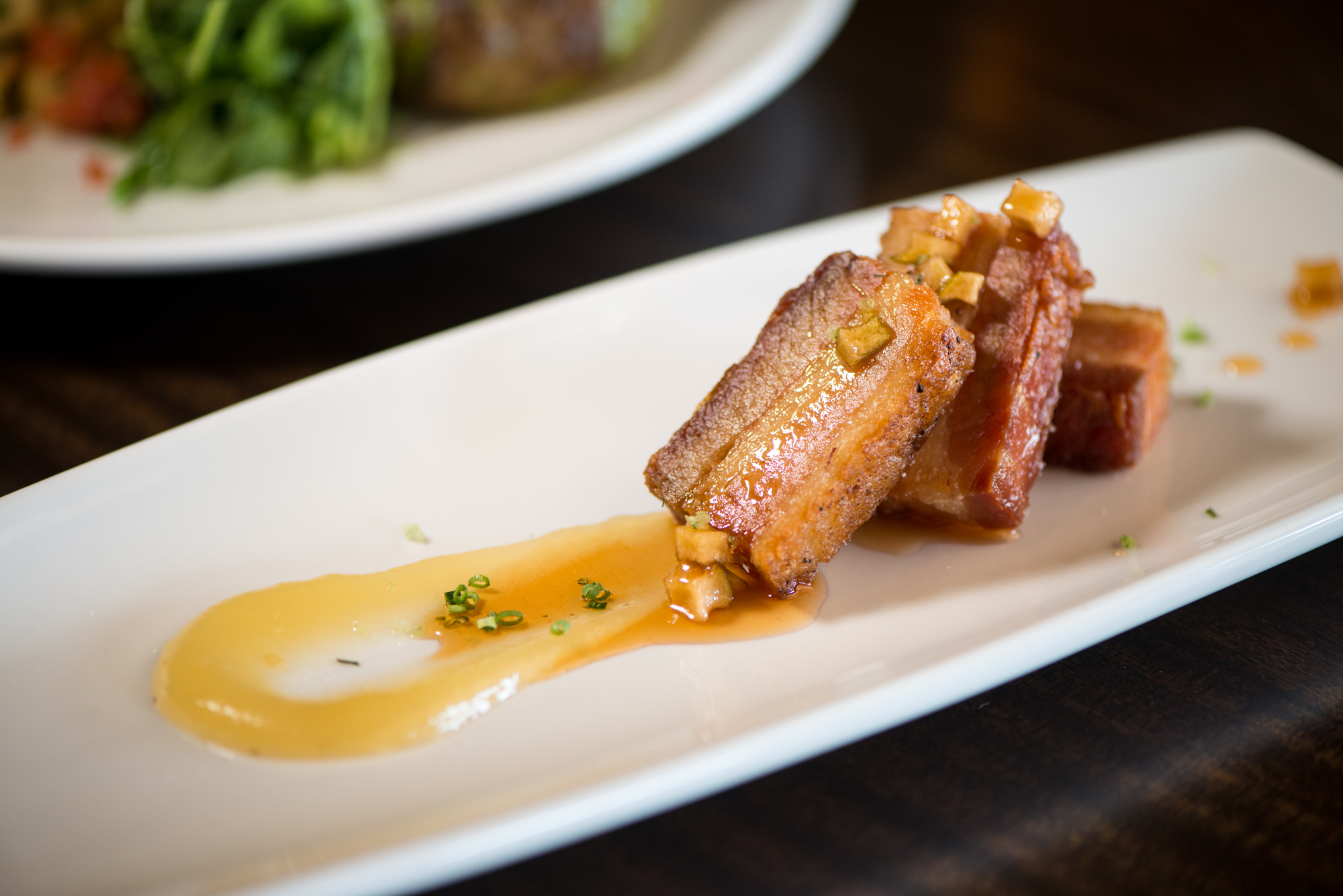 From the Earth Georgia Pork Belly with gala apple puree, roasted granny smith apples, and crisped fennel. Photo credit- Mia Yakel.