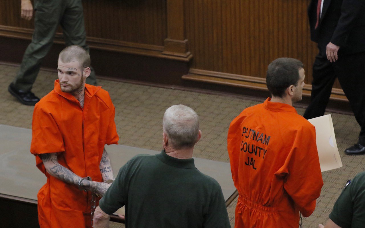 Ricky Dubose (left) and Donnie Rowe leave the Putnam County courthouse in Eatonton on June 21, 2017. The two are accused of killing two correctional officers while escaping from a prison transport bus. (BOB ANDRES/AJC)