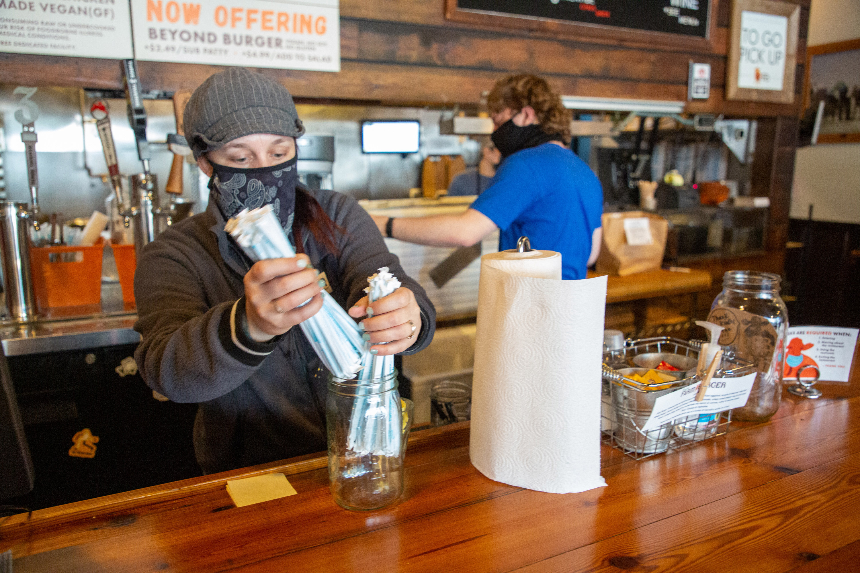 Farm Burger manager Dana Harrison wears a mask while getting ready for their lunch rush in Decatur Monday, February 28, 2020. STEVE SCHAEFER FOR THE ATLANTA JOURNAL-CONSTITUTION
