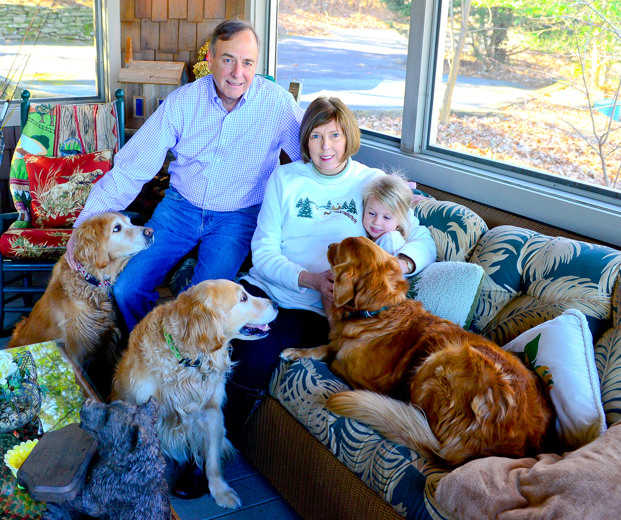 Retired Channel 2 Action News anchor John Pruitt and his wife, Andrea, are joined by granddaughter Sara Mundy, and their three golden retrievers, Cassie, Sandy and Toby at the Big Canoe home they've owned for 10 years.