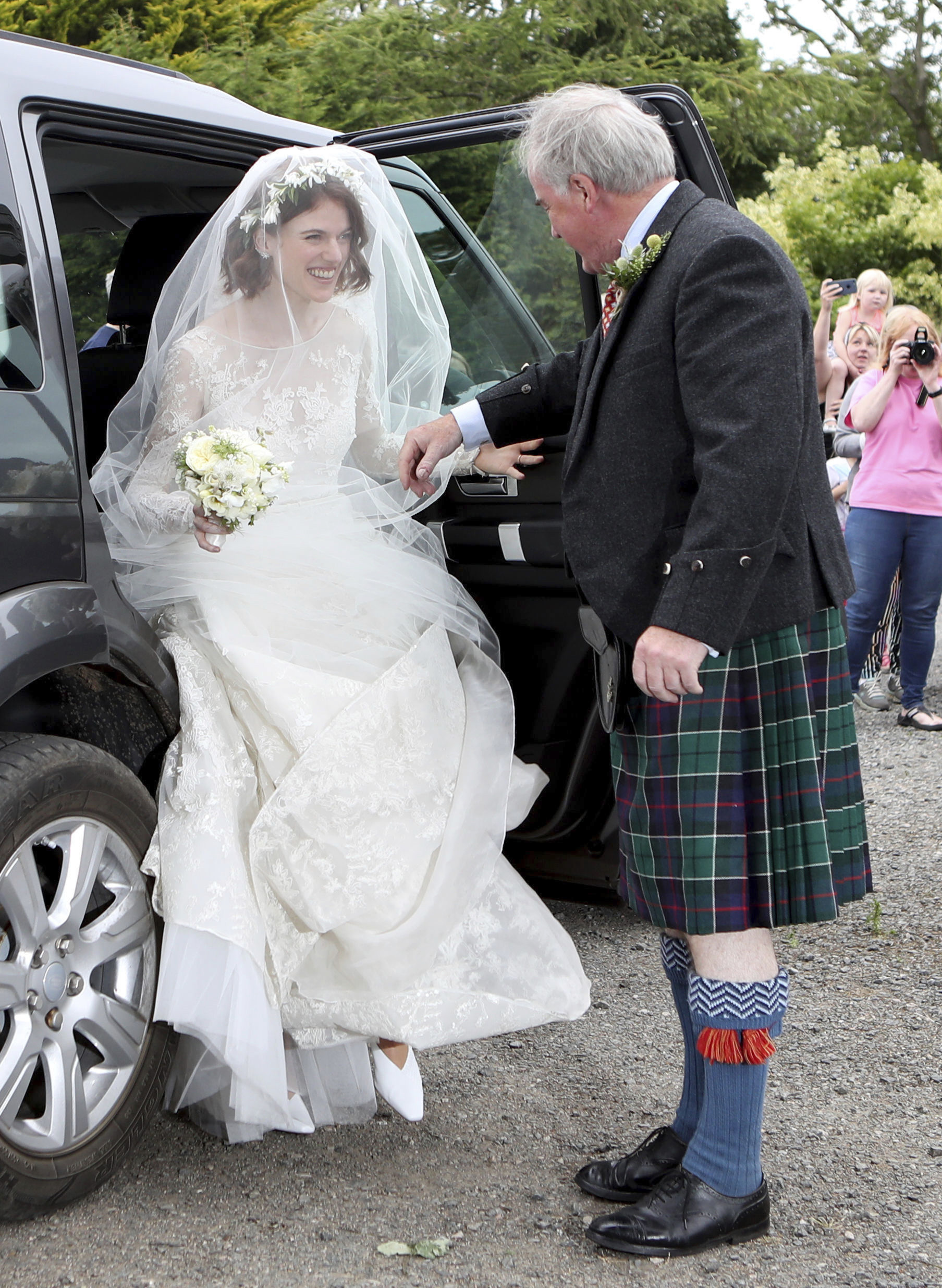 Actress Rose Leslie is escorted by her father Sebastian as they arrive for her wedding at Rayne Church, Kirkton of Rayne in Aberdeenshire, Scotland, Saturday June 23, 2018.