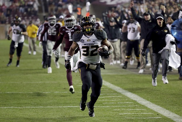 Missouri running back Russell Hansbrough (32) rushes 45 yards for a touchdown against Texas A&M during the second half of an NCAA college football game Saturday, Nov. 15, 2014, in College Station, Texas. (AP Photo/David J. Phillip) This is a picture of Missouri. Georgia wants Missouri to lose. (David J. Philip/AP photo)
