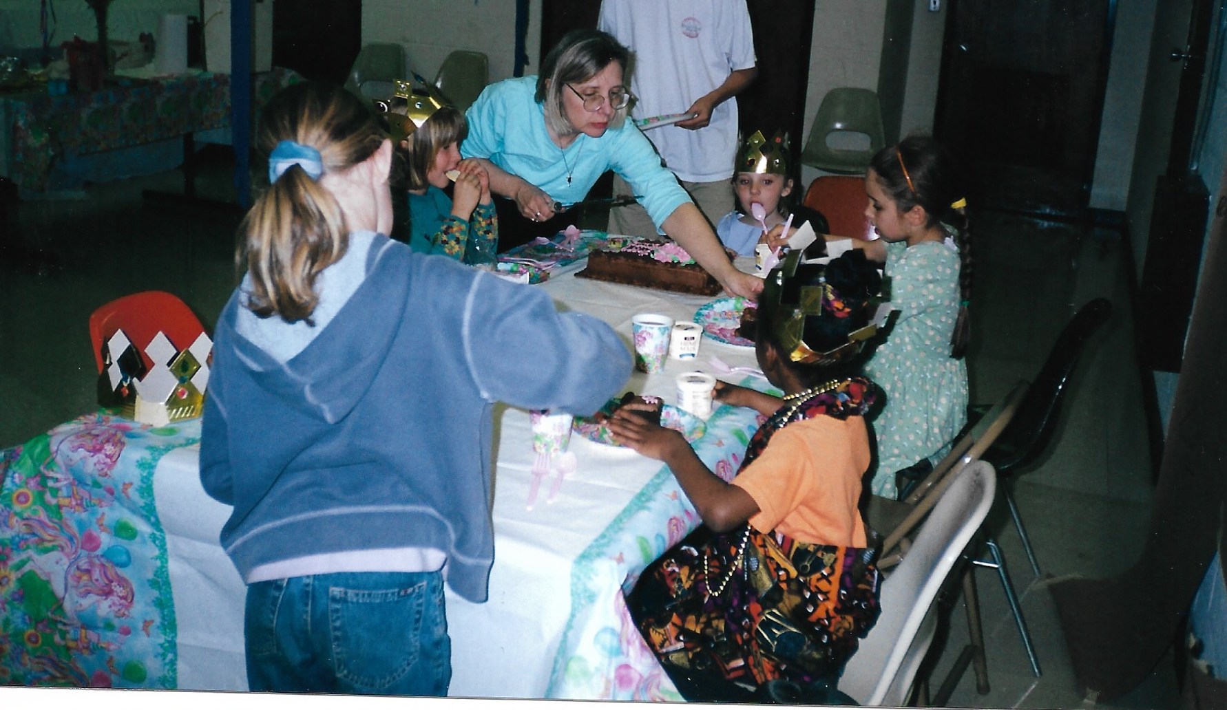 Leslie King serves birthday cake during daughter Olivia's sixth birthday celebration at the former YWCA on Lawrenceville Highway in Decatur.  (Courtesy of the King family)
