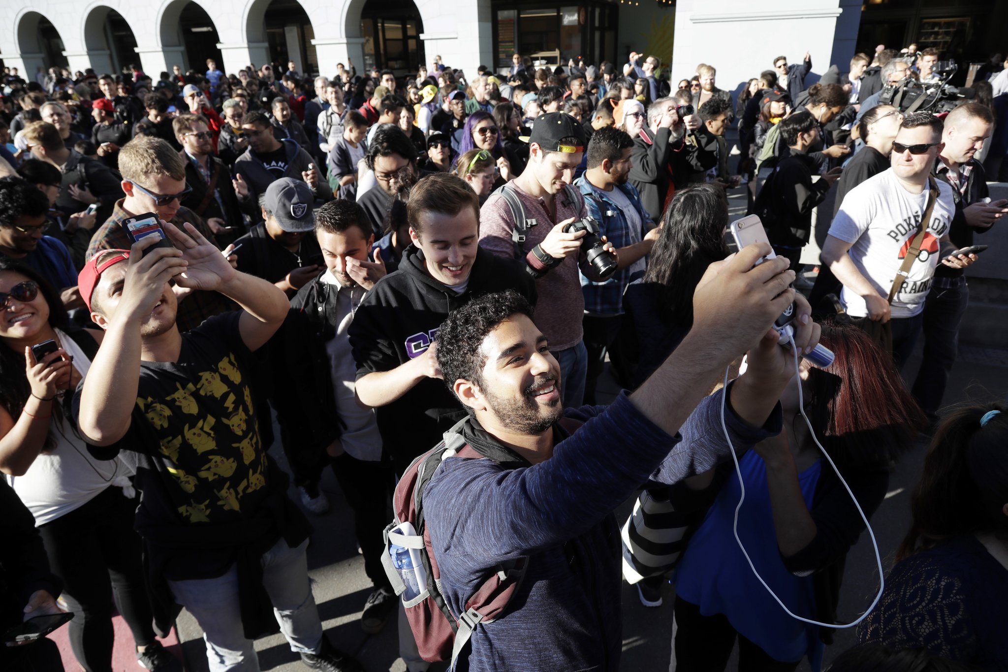 “Pokemon Go” players in July begin a group walk along the Embarcadero in San Francisco. (AP Photo/Marcio Jose Sanchez, File)
