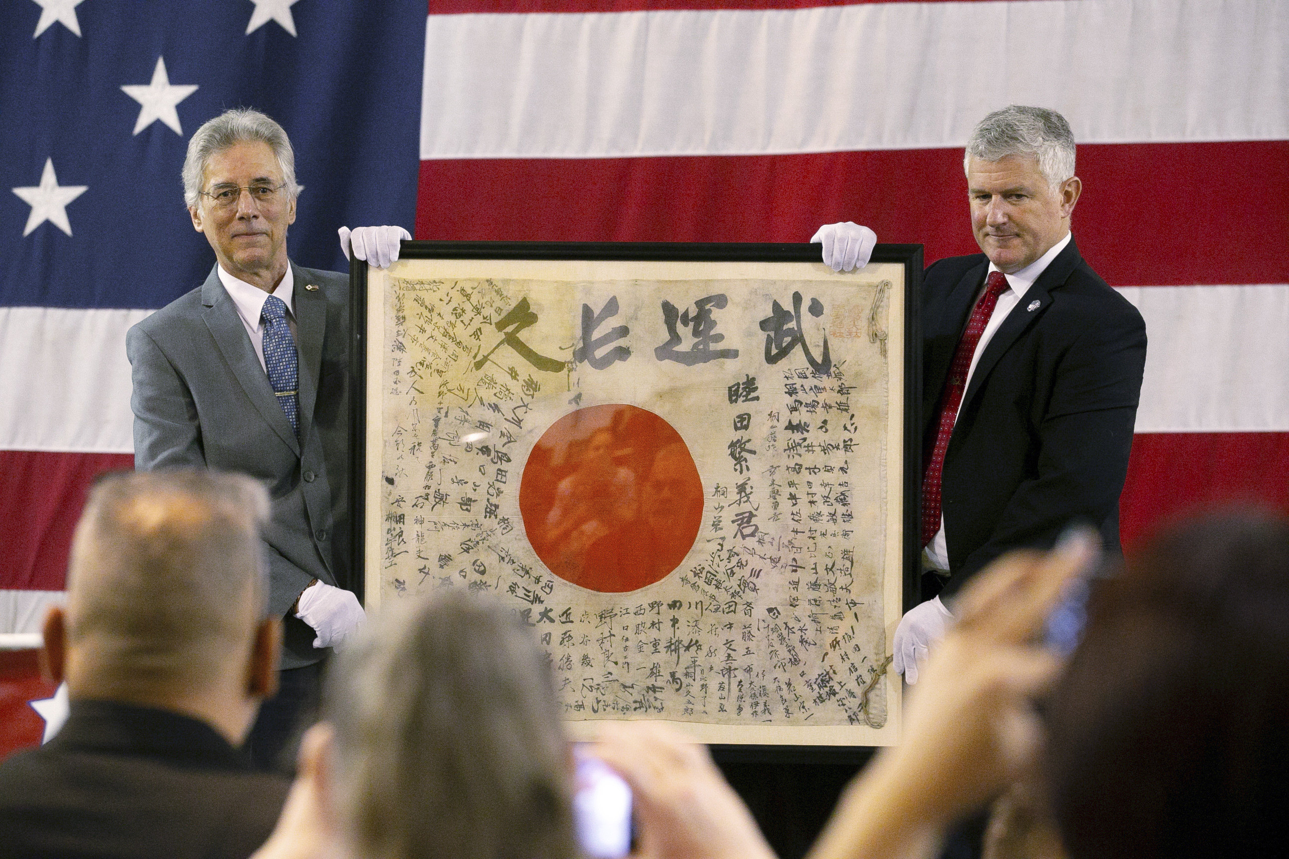 A flag carried by a WWII Japanese soldier is returning to his family