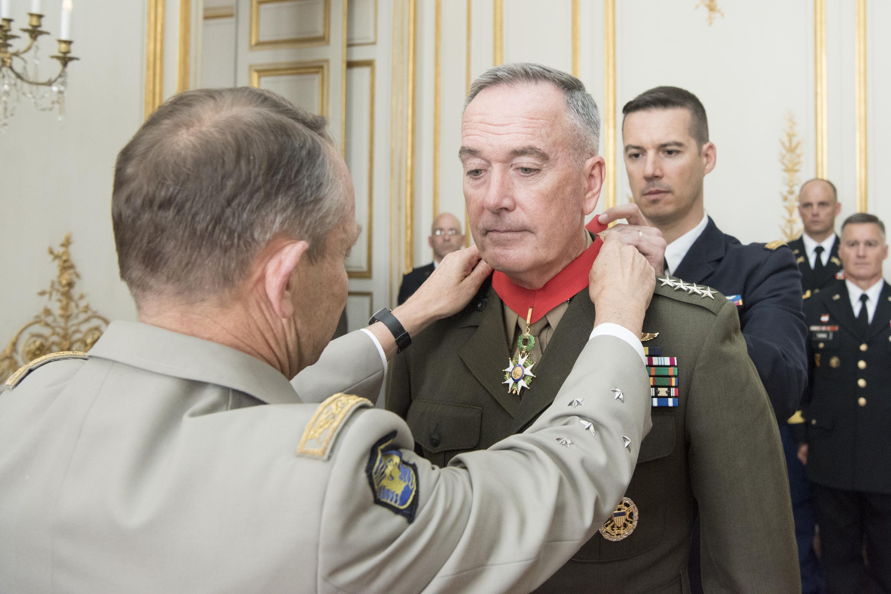 French soldiers receiving France's highest honors, the Cross of