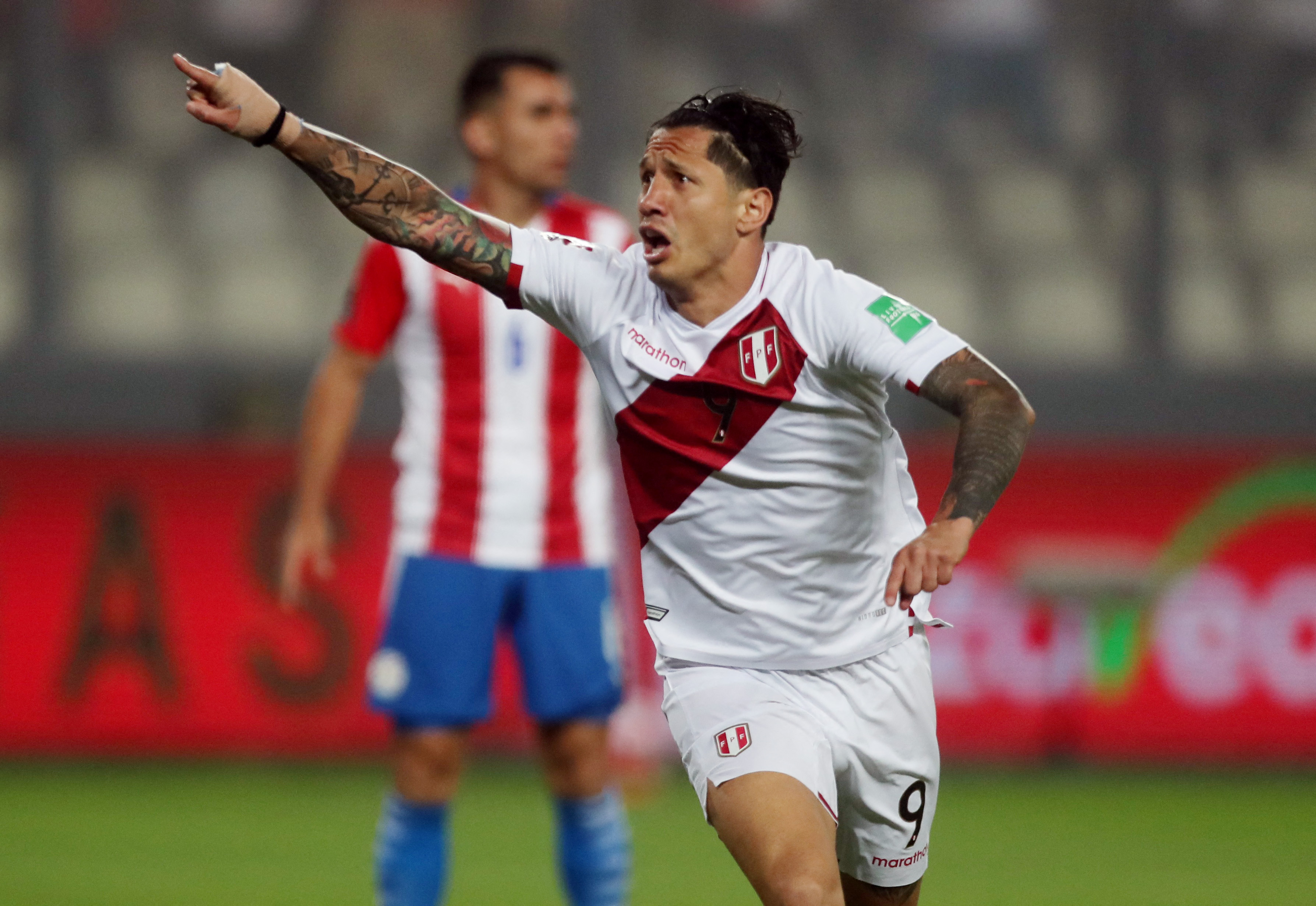 Soccer Football - World Cup - South American Qualifiers - Peru v Paraguay - Estadio Nacional, Lima, Peru - March 29, 2022  Peru's Gianluca Lapadula celebrates scoring their first goal REUTERS/Sebastian Castaneda