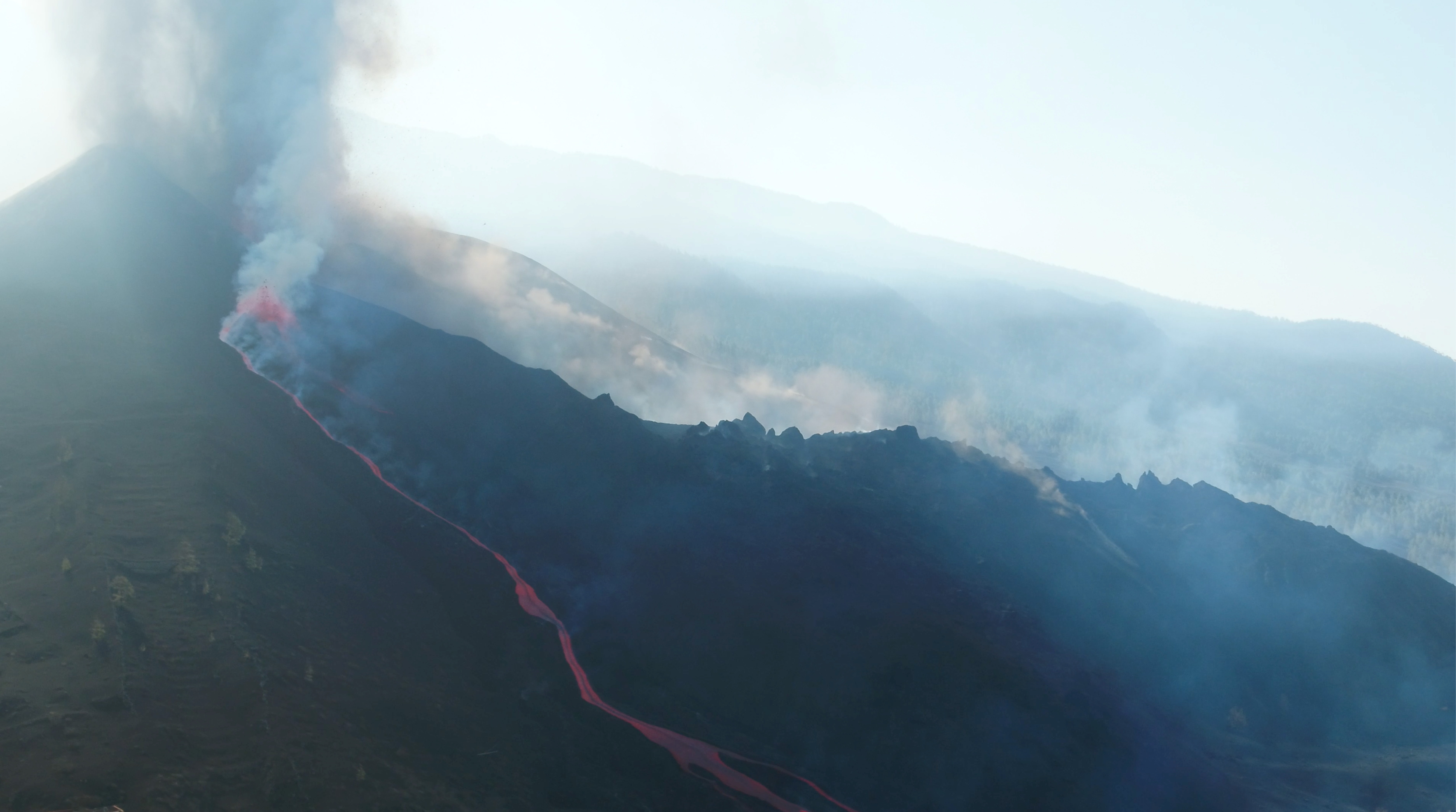 A screengrab from a drone footage shows lava flowing following the eruption of a volcano in the Cumbre Vieja park, on the Canary Island of La Palma, Spain September 26, 2021. Footage obtained on September 26, 2021. REUTERS TV via REUTERS