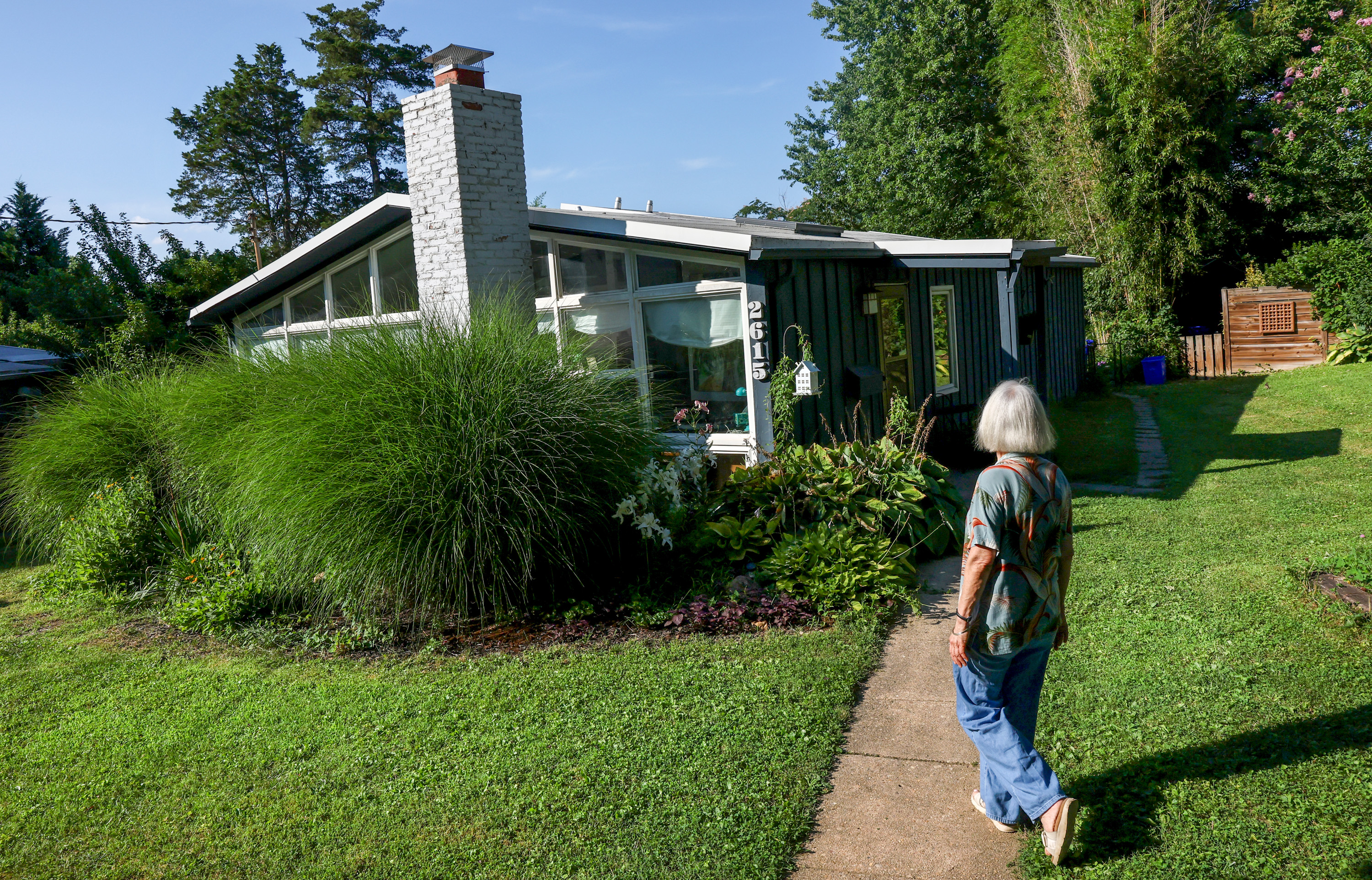 Marina Sefcik Callahan walks up to her Charles Goodman designed home ahead of a planned 75th anniversary celebration of Goodman houses found in the Wheaton Crest neighborhood of Silver Spring.