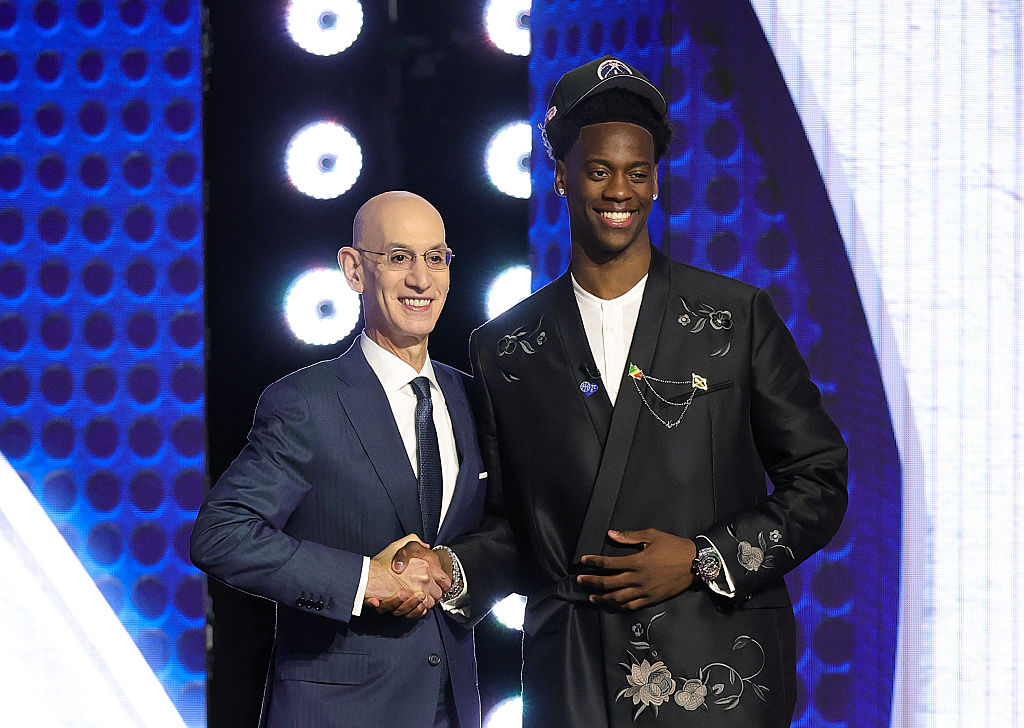 NBA commissioner Adam Silver shakes hands with AJ Dybantsa after he is drafted first overall by the Washington Wizards.
