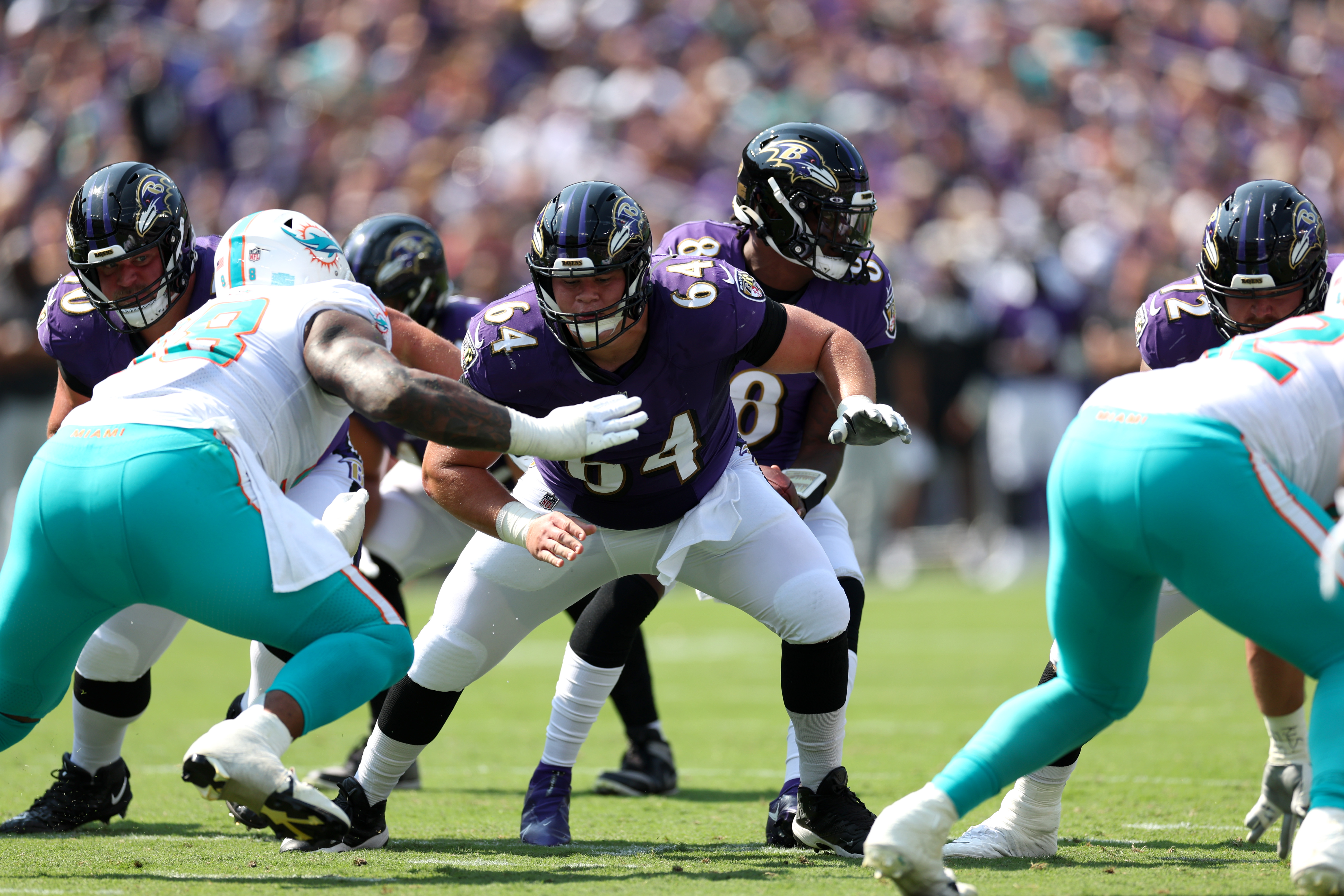 Baltimore Ravens center Tyler Linderbaum (64) looks on during pre