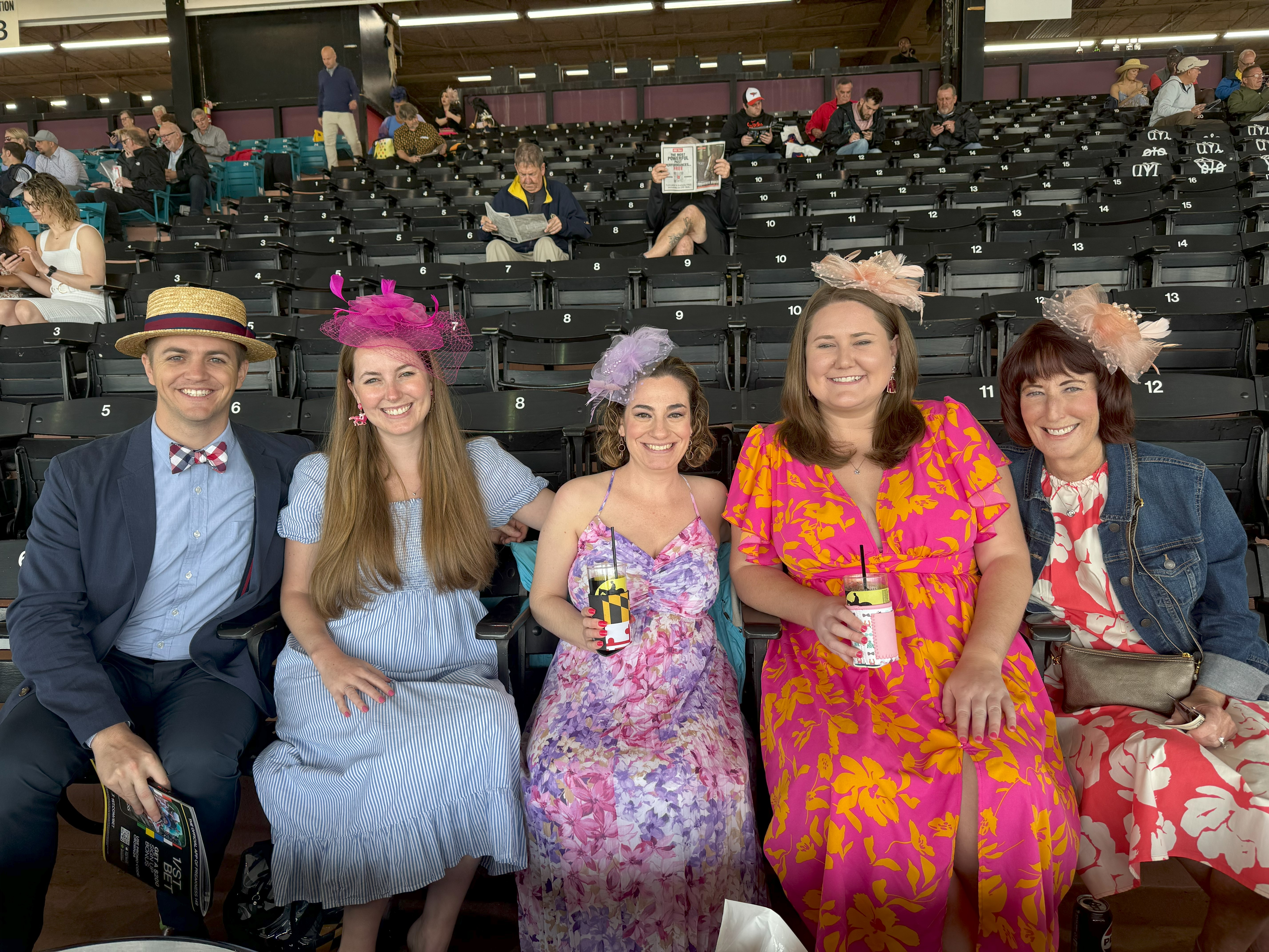 Maggie Oliver, her sister and brother-in-law Elizabeth and Cody Murphy at the Preakness Stakes. (Clara Longo de Freitas/The Baltimore Banner)