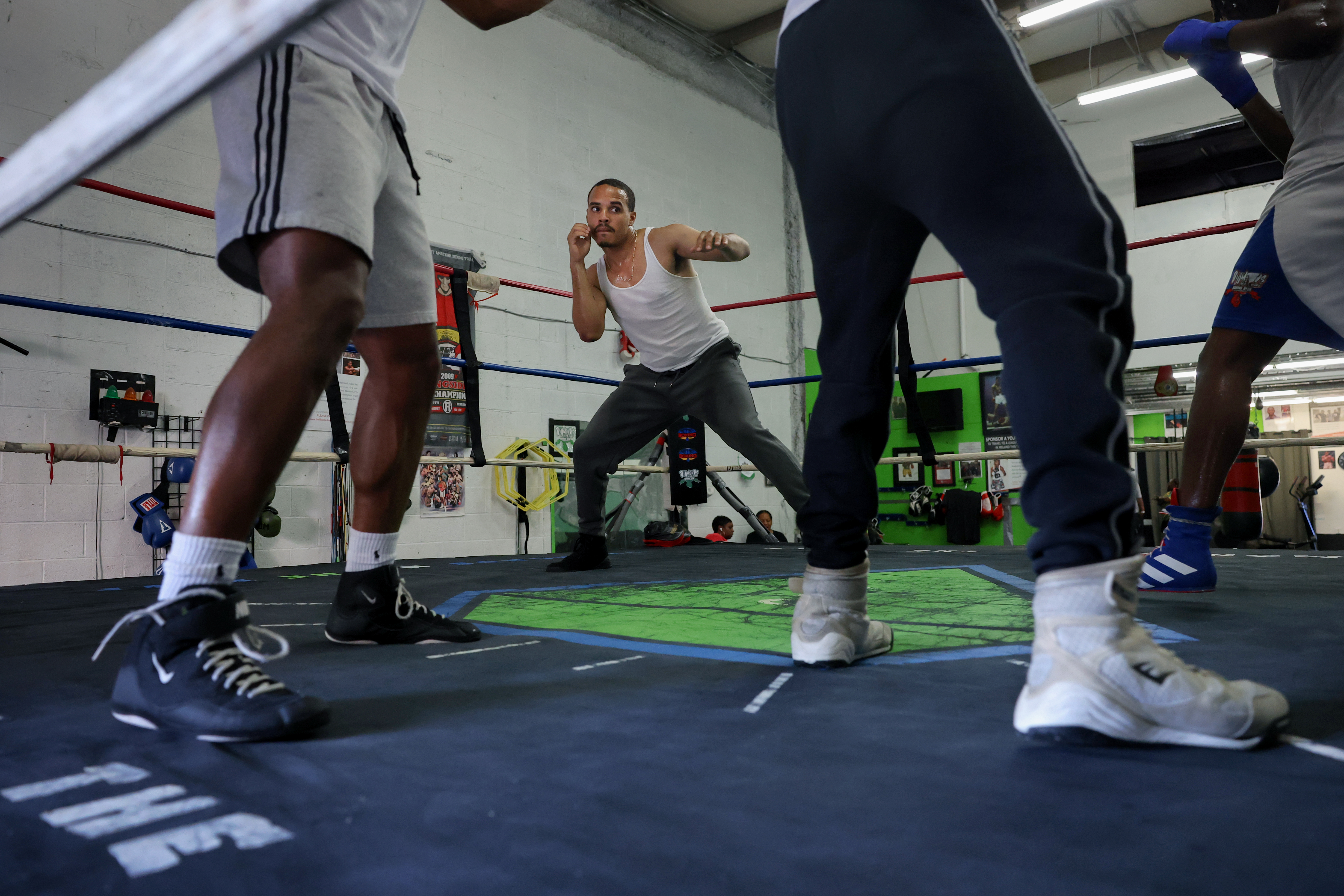 Yran Butler, 26, does shadow boxing drills with fellow boxers during training at Diamond N' the Ruff boxing gym in Forestville, MD, U.S., August 5, 2026. Leah Millis for the Baltimore Banner