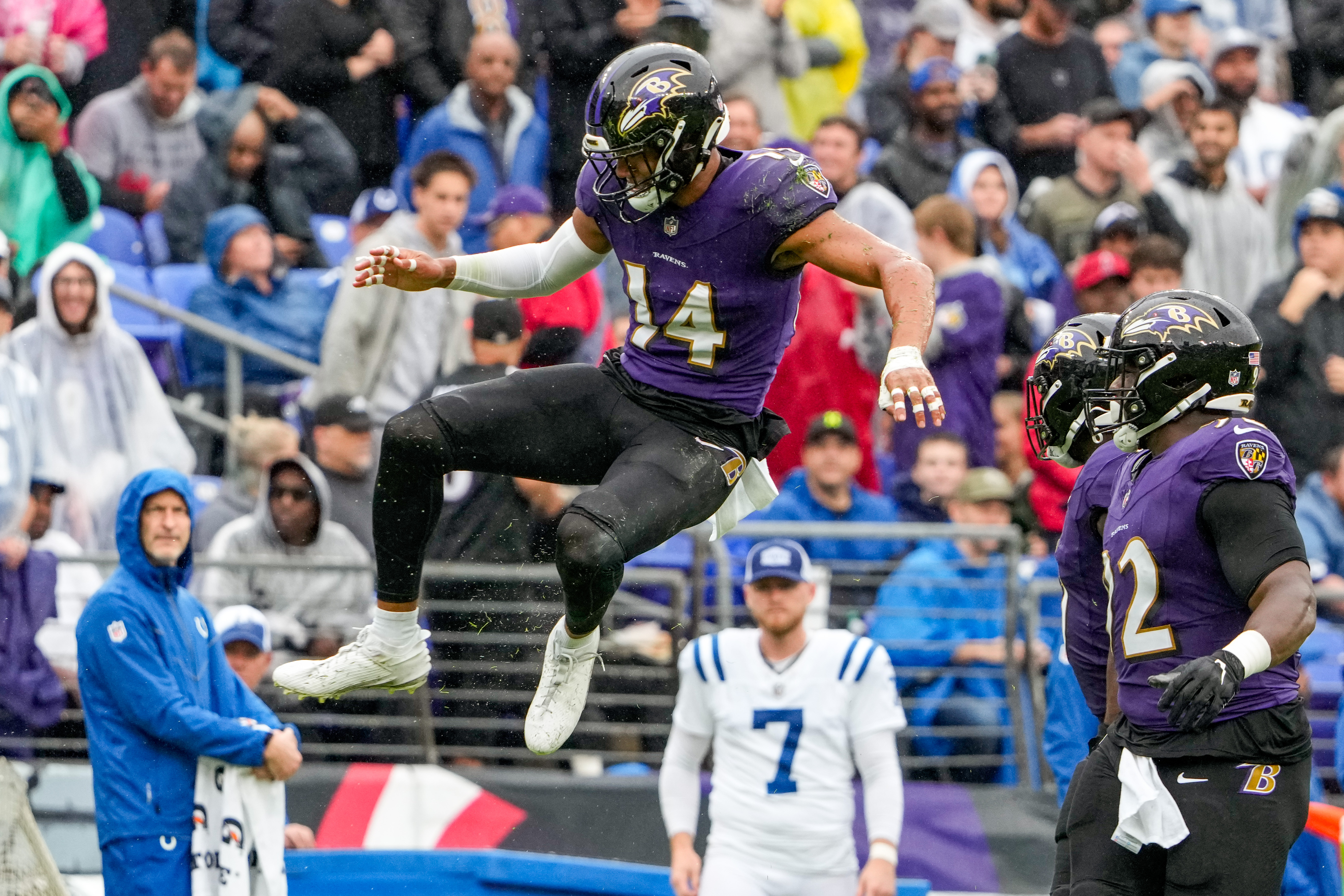 Baltimore Ravens running back Justice Hill, right, celebrates his