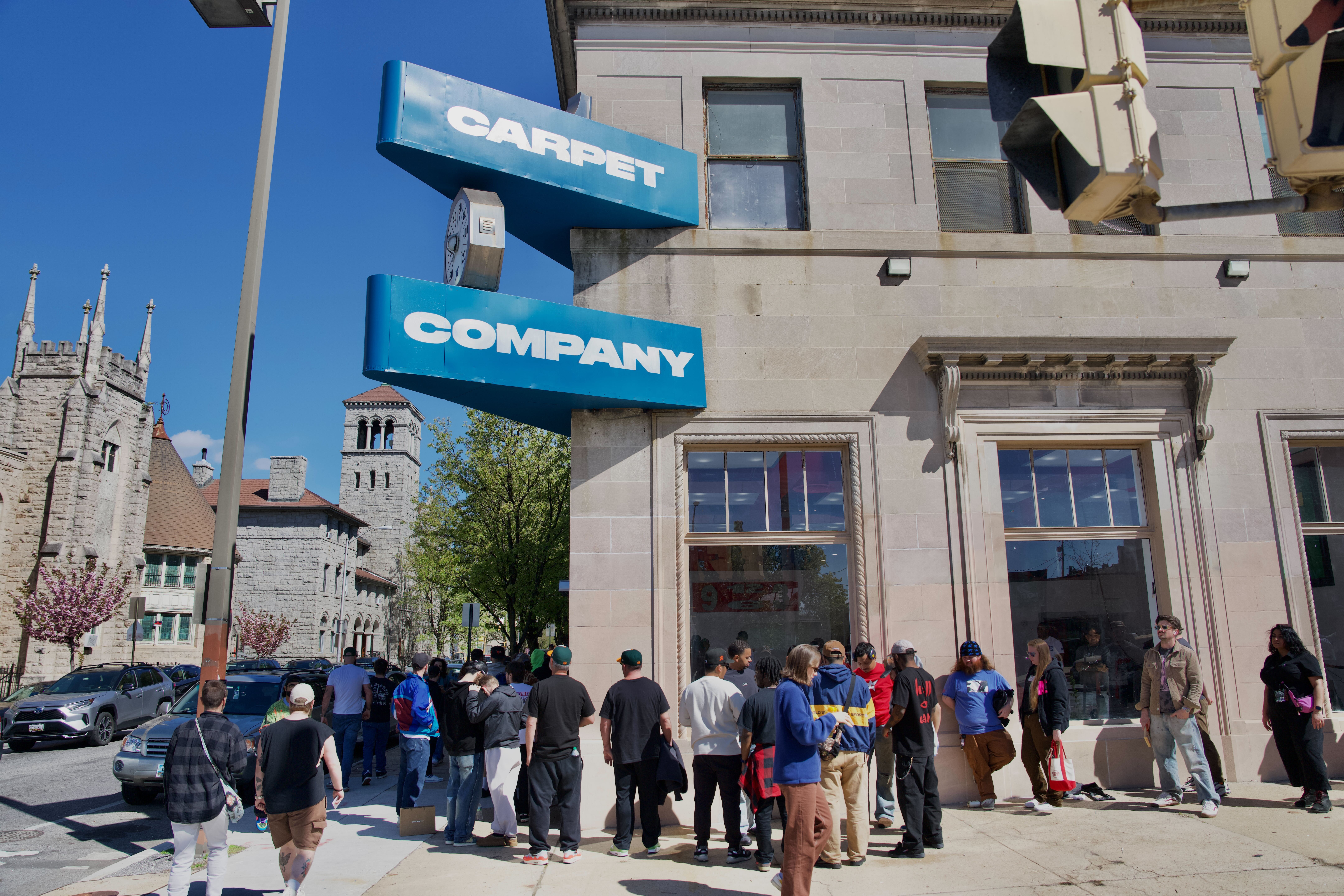 Hundreds wait in line for Carpet Company store opening in