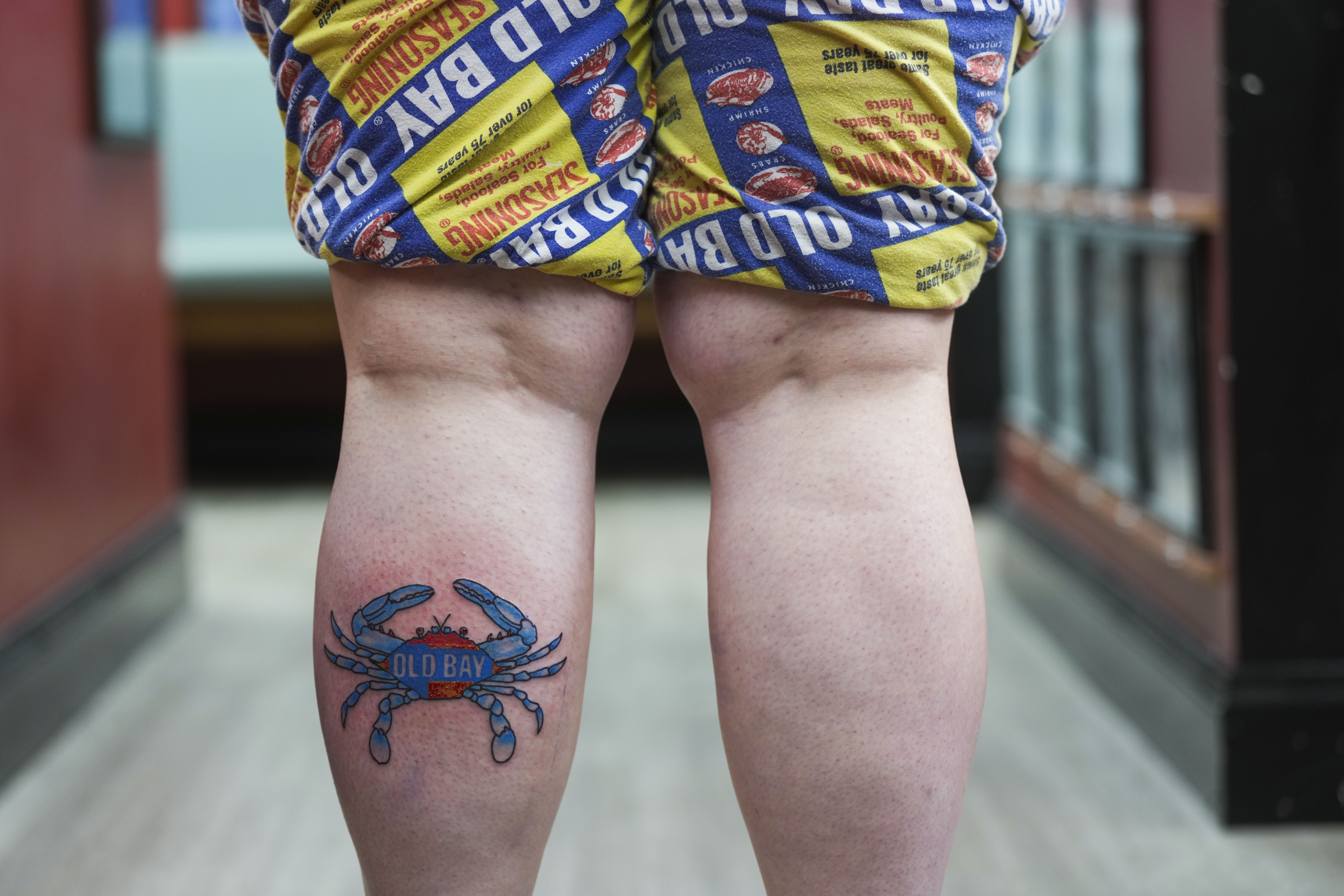 Hundreds line up for Old Bay-themed tattoos ahead of Preakness - The Baltimore Banner