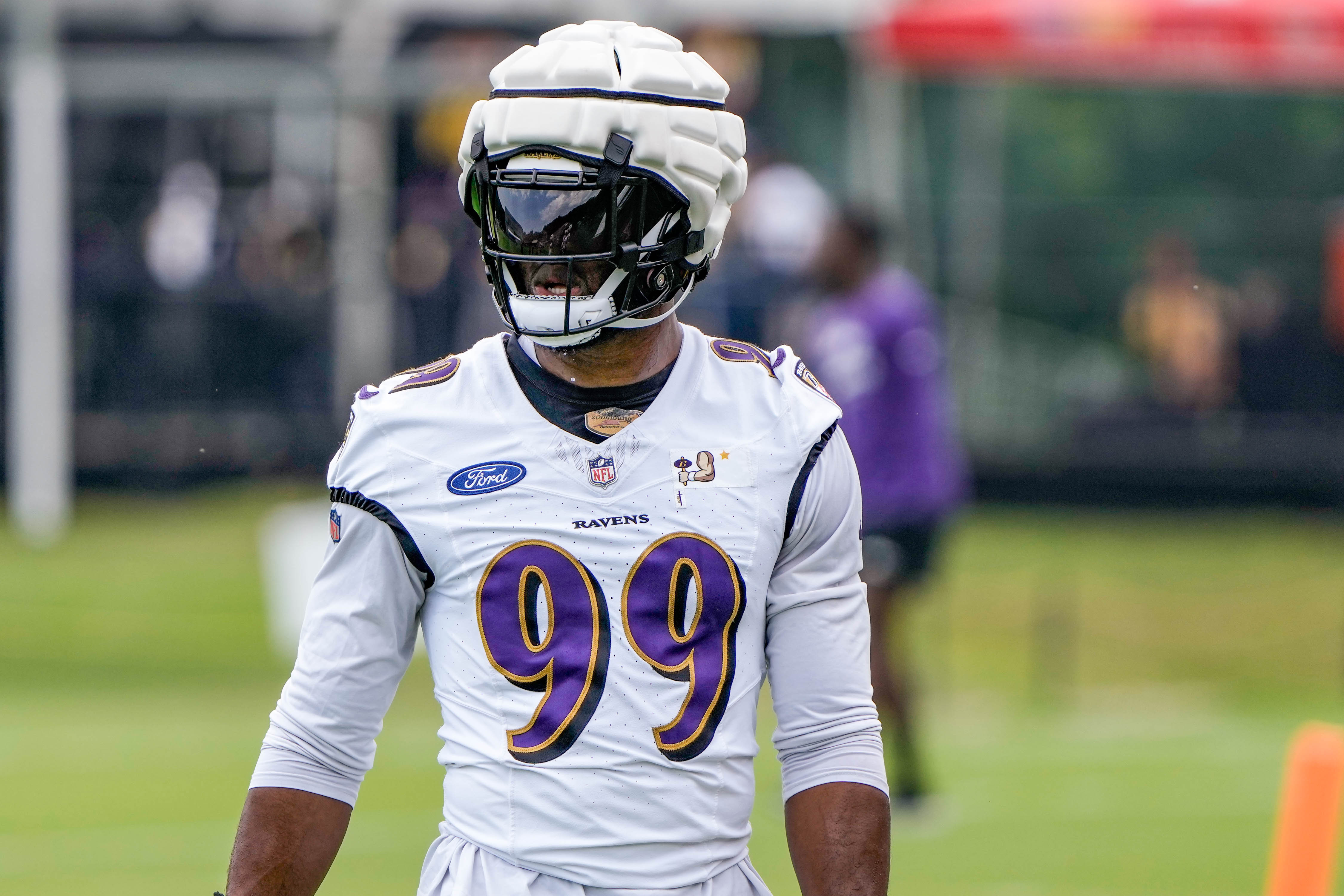 Baltimore Ravens linebacker Odafe Oweh (99) walks off the field