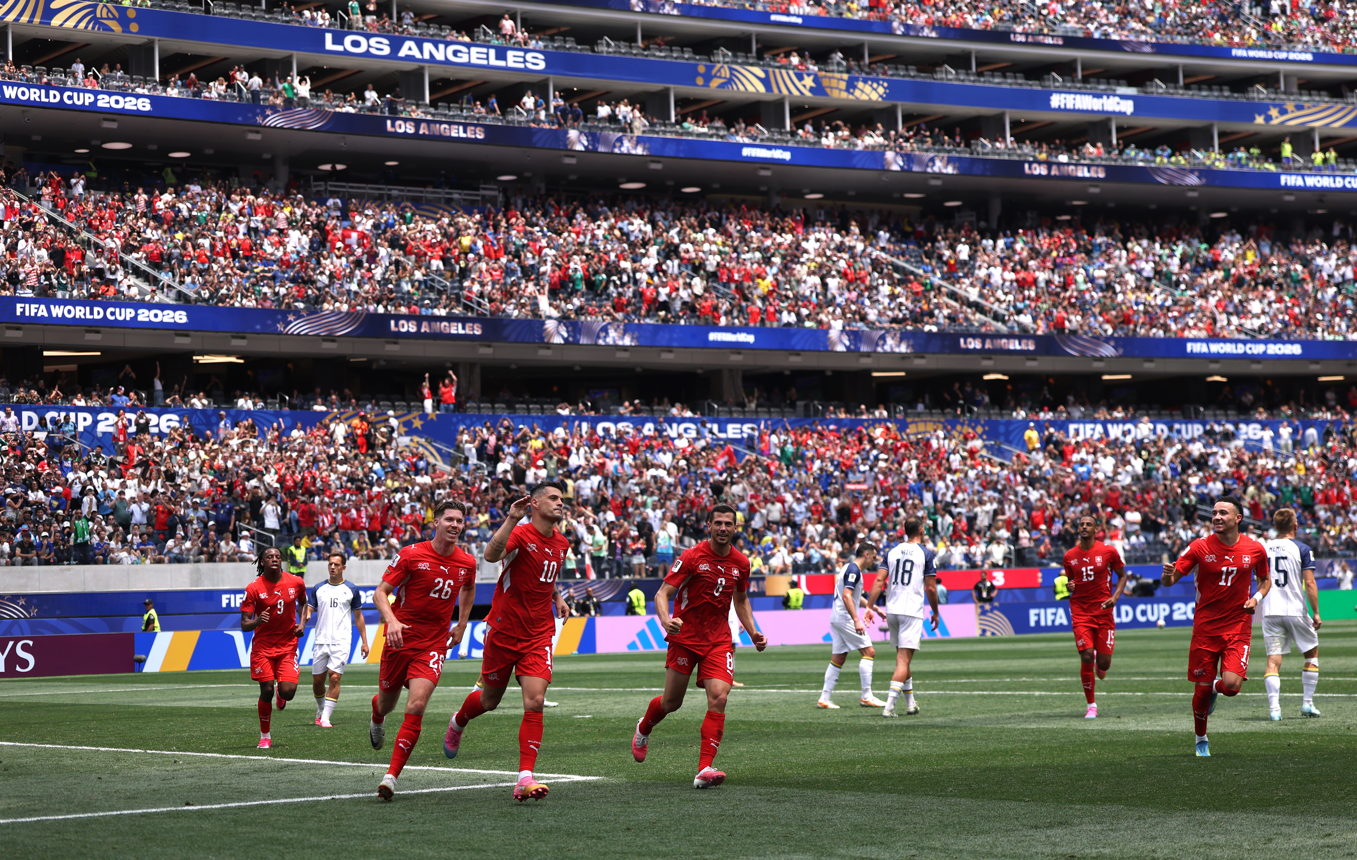 INGLEWOOD, CALIFORNIA - JUNE 18: Granit Xhaka #10 of Switzerland celebrates with teammates after scoring the team's fourth goal during the FIFA World Cup 2026 Group B match between Switzerland and Bosnia and Herzegovina at Los Angeles Stadium on June 18, 2026 in Inglewood, California. (Photo by Dean Mouhtaropoulos/Getty Images)