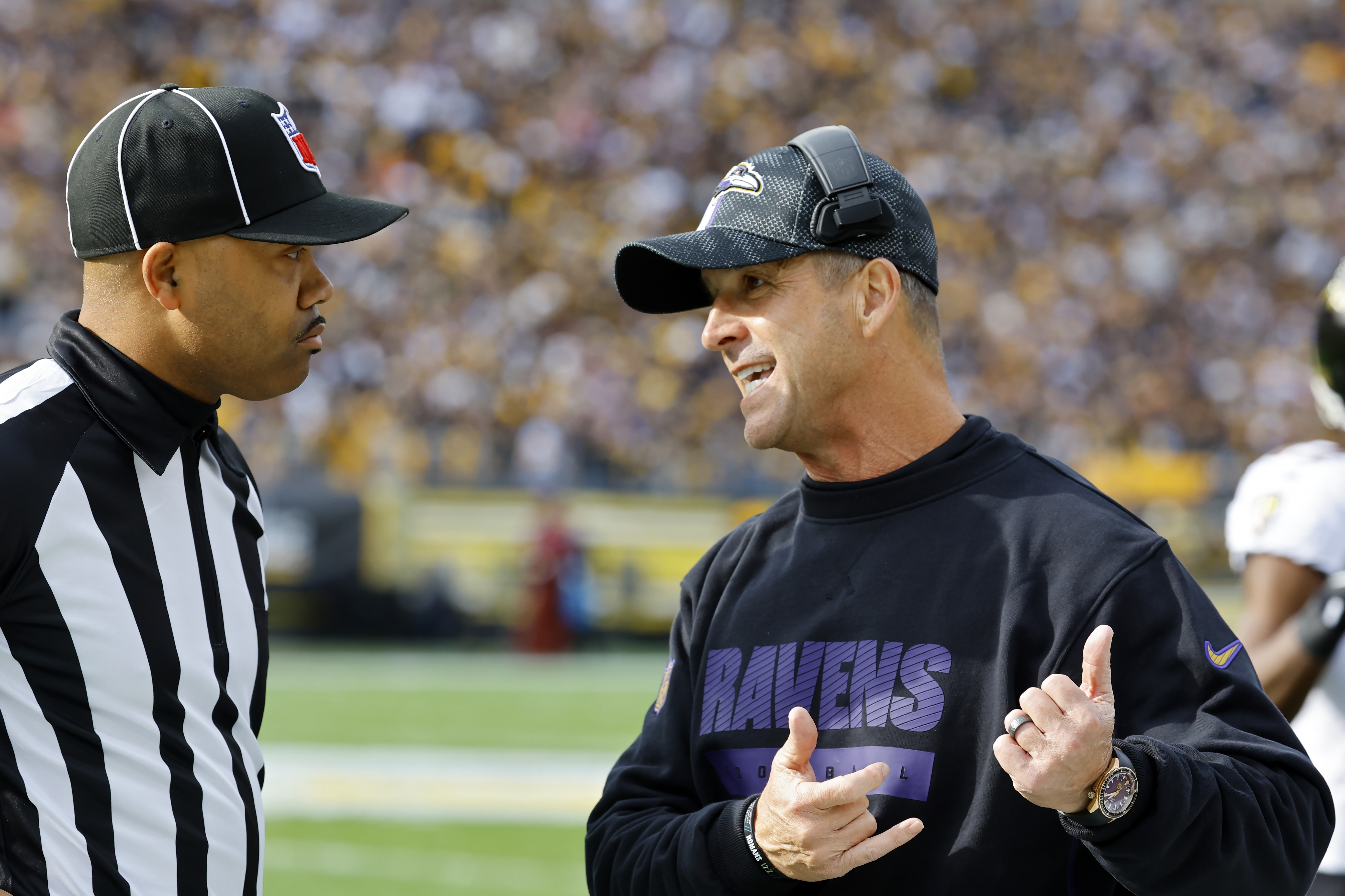 PITTSBURGH, PENNSYLVANIA - NOVEMBER 17: Head coach John Harbaugh of the Baltimore Ravens talks to an official in the first quarter of a game against the Pittsburgh Steelers at Acrisure Stadium on November 17, 2024 in Pittsburgh, Pennsylvania. (Photo by Justin K. Aller/Getty Images)