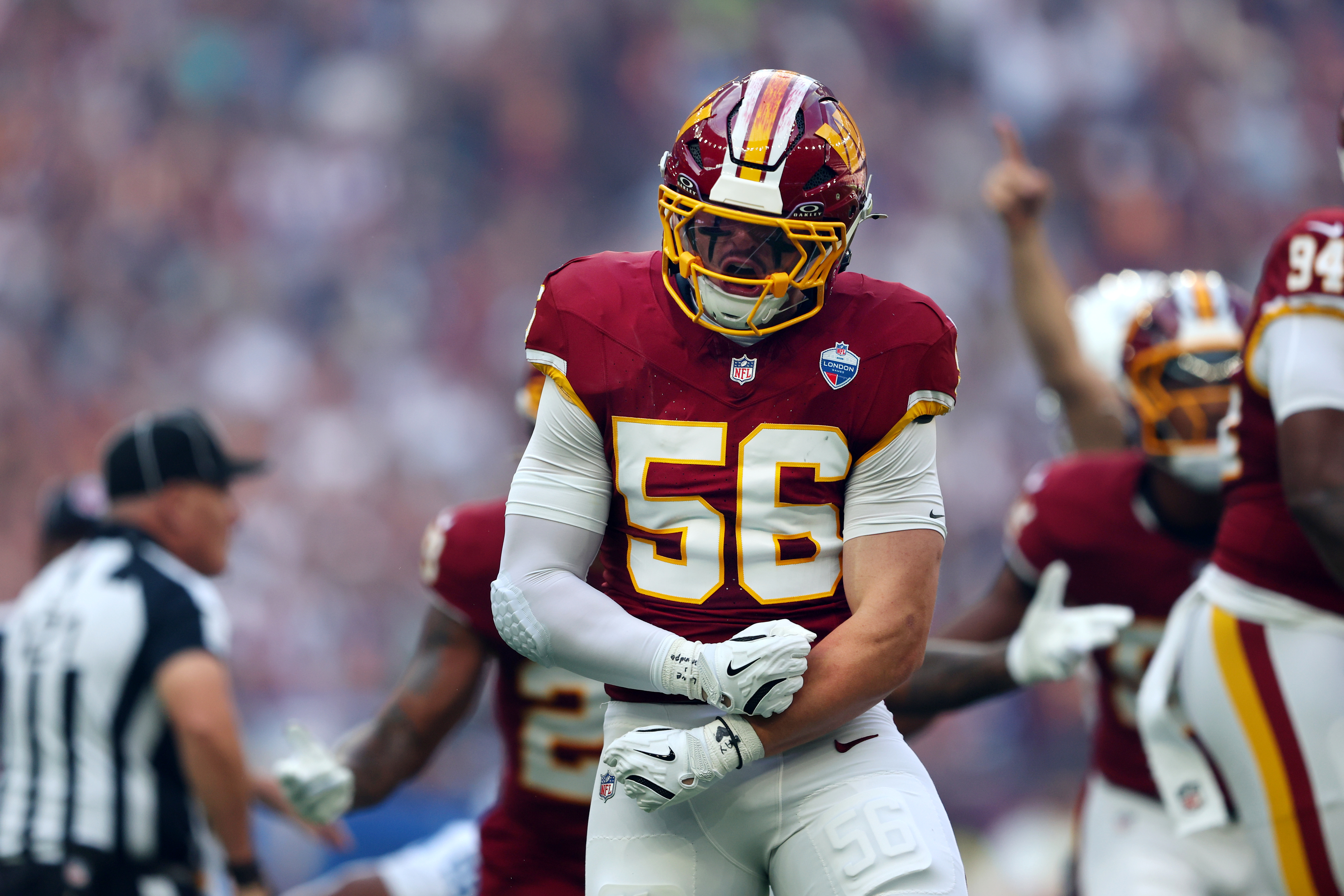Washington Commanders linebacker Kain Medrano (56) celebrates after a fumble recovery during the first half of an NFL football game between the Commanders and the Indianapolis Colts in London on Sunday, Oct. 4, 2026. (AP Photo/Adam Bettcher)