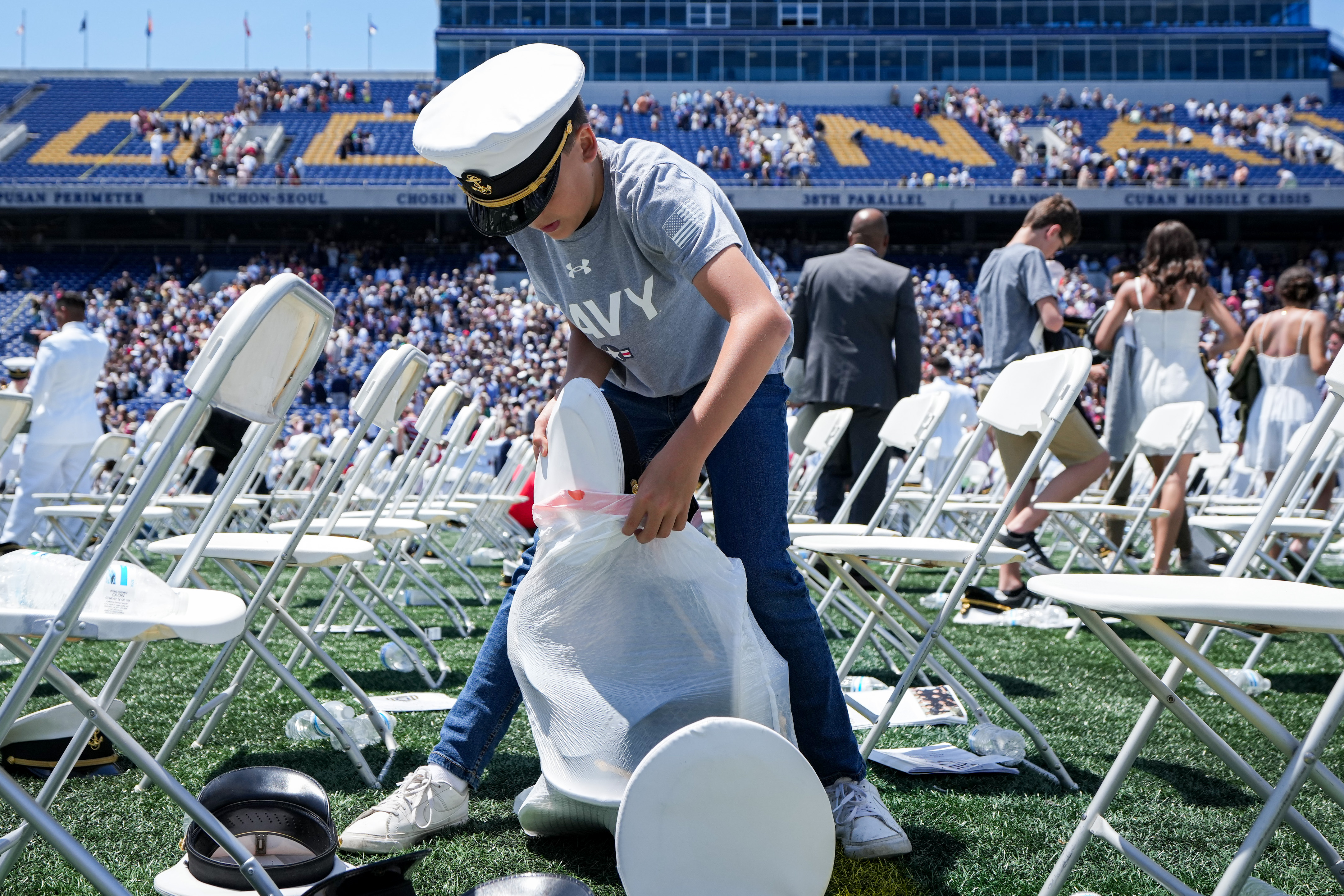 Naval Academy grads toss hats