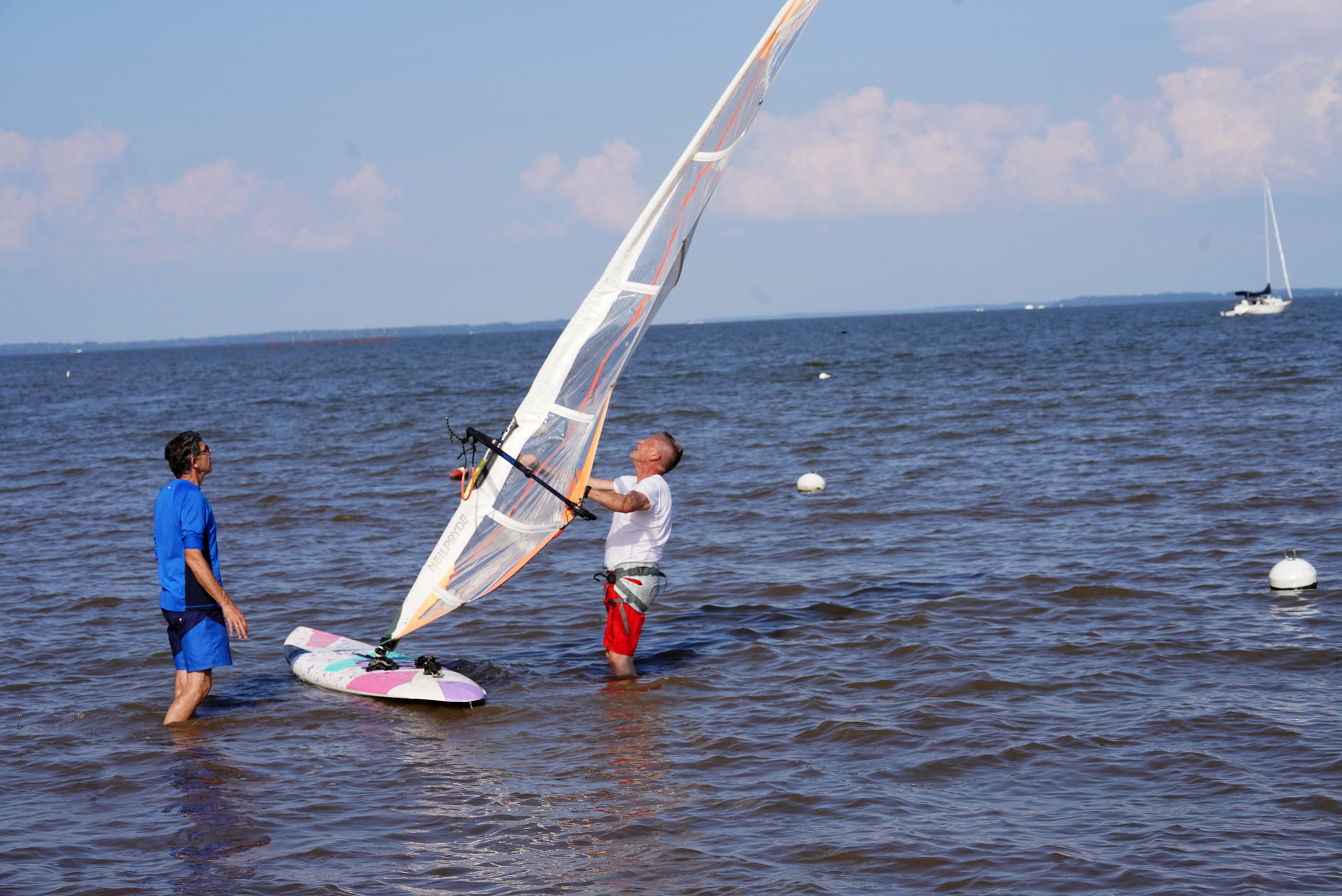 Rocky Point Beach and Park in Essex is open year-round for fishing, boating, and picnicking. Located on 375-acres at the mouth of the Back and Middle Rivers, Rocky Point offers stunning views of the Chesapeake Bay,  Tom Schiller, pastor of the Greater Grace Church  was out wind surfing with the help of Daniel LaRose ( Blue shirt).