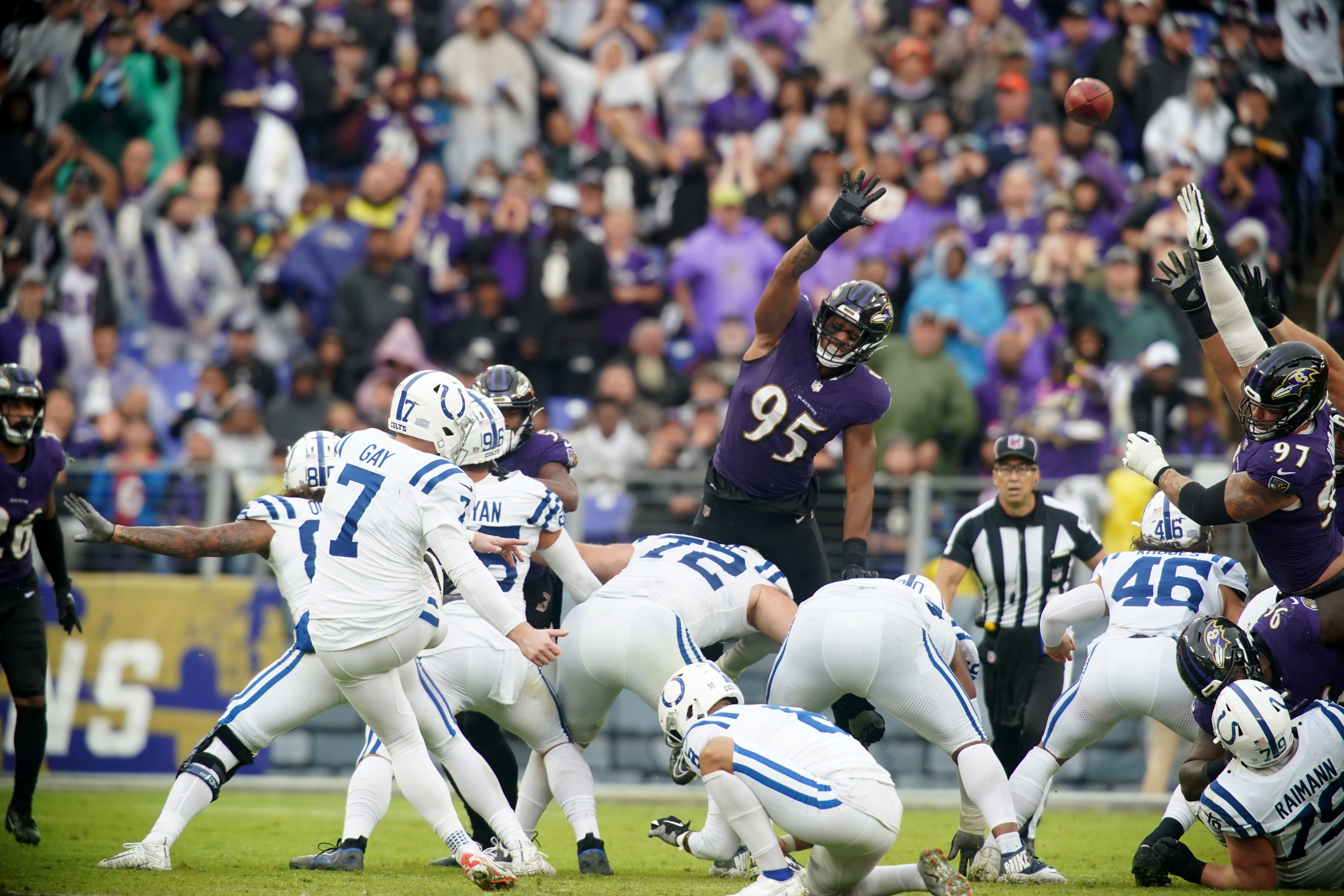 Baltimore Ravens linebacker Tavius Robinson (95) runs during an