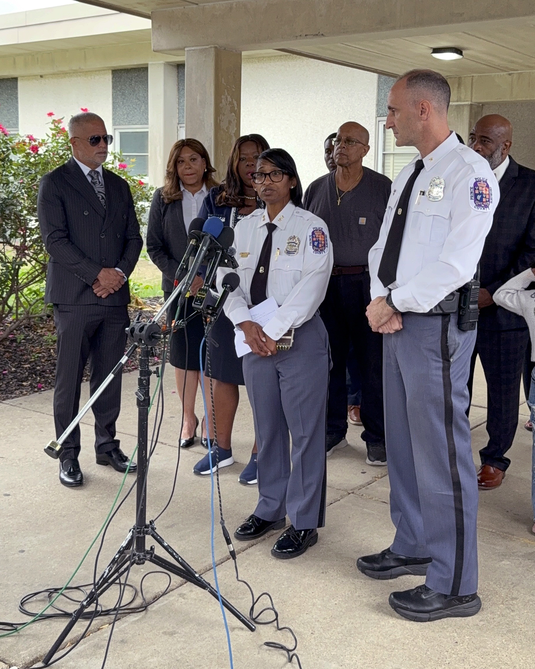 Deputy Shief Shawné Waddy and Asst. Dep. Chief Jason Fisher address the media in front of Arrowhead Elementary School during a news conference about a public suicide death.