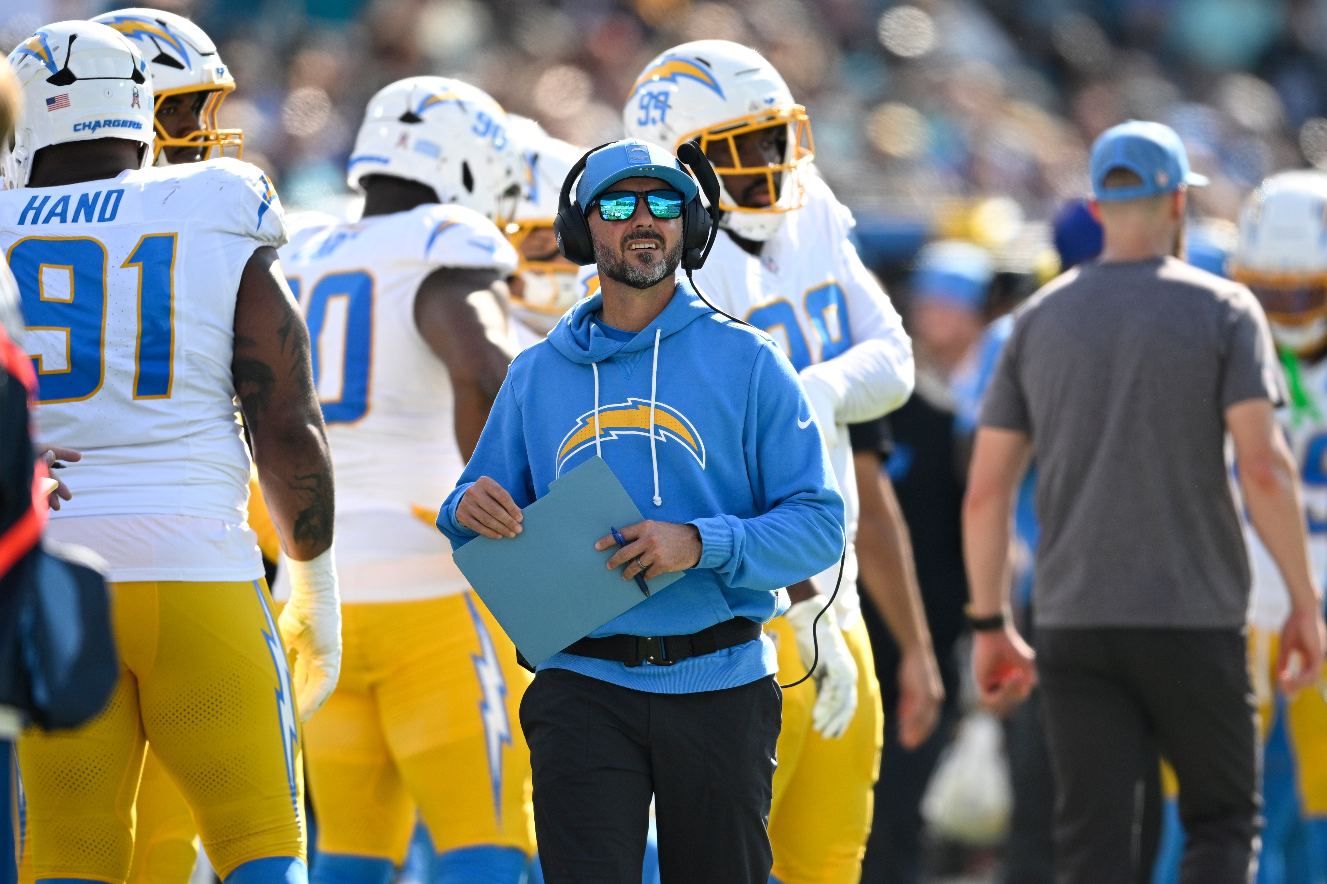 Former Los Angeles Chargers defensive coordinator Jesse Minter, center, looks on during the first half of a game against the Jacksonville Jaguars on Nov. 16, 2025.