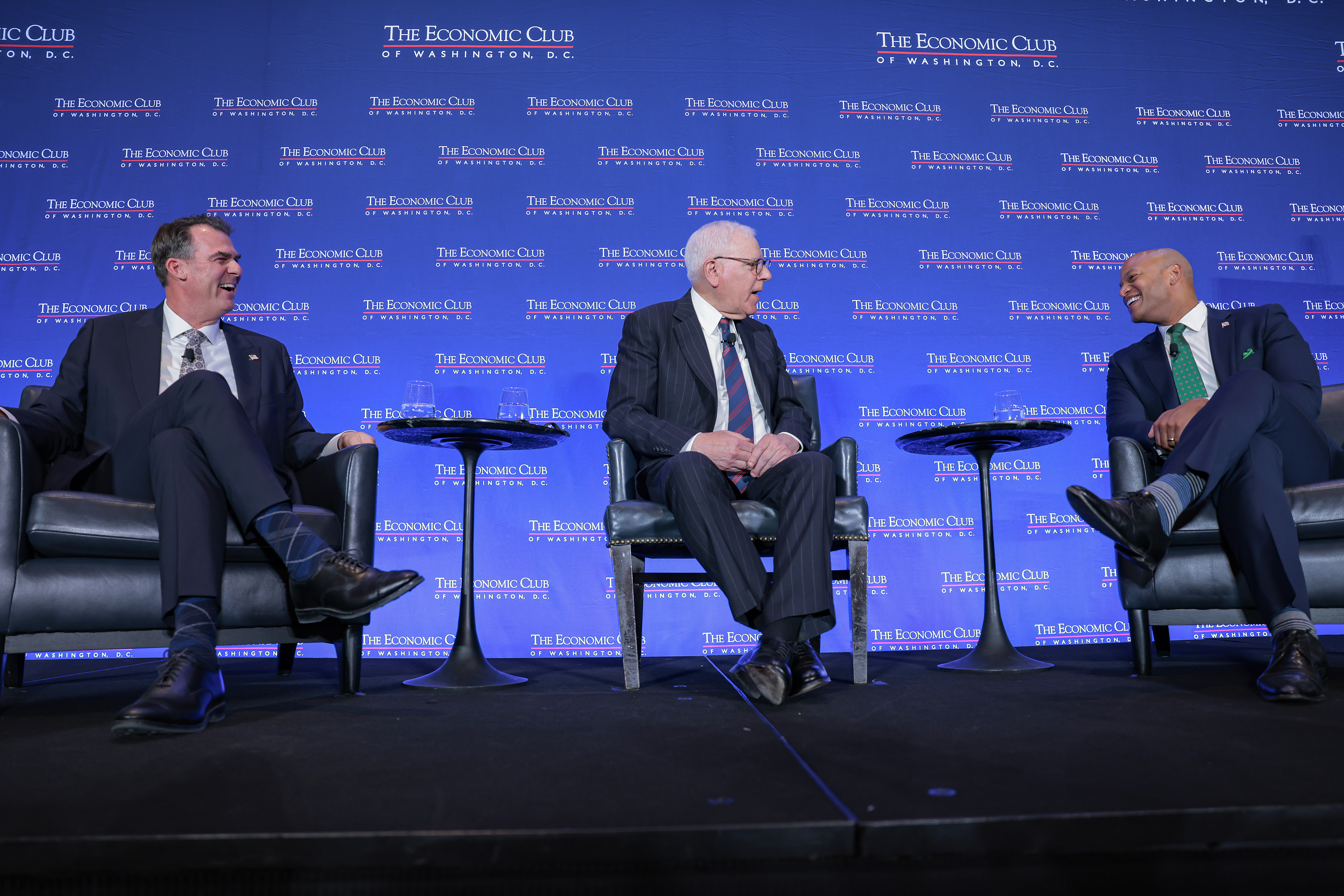 WASHINGTON, DC - FEBRUARY 18: David Rubenstein (C) interviews Maryland Gov. Wes Moore (R) and Oklahoma Gov. Kevin Stitt (L) at the Economic Club on February 18, 2026 in Washington, DC. As Chair and Vice Chair of the National Governors Association, Stitt and Moore discussed the NGA’s bipartisan “Reigniting the American Dream” initiative. (Photo by Heather Diehl/Getty Images)
