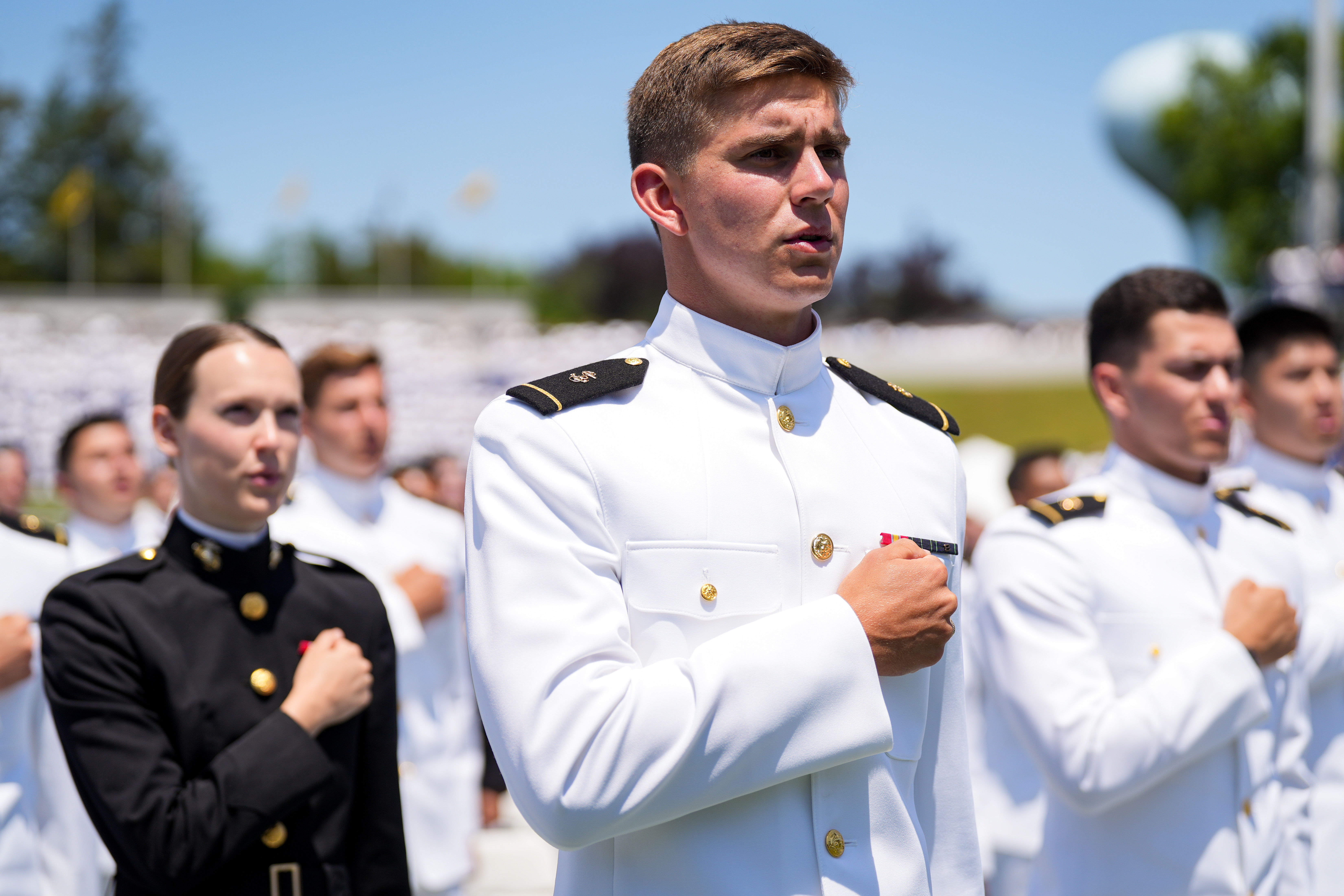 Naval Academy grads toss hats