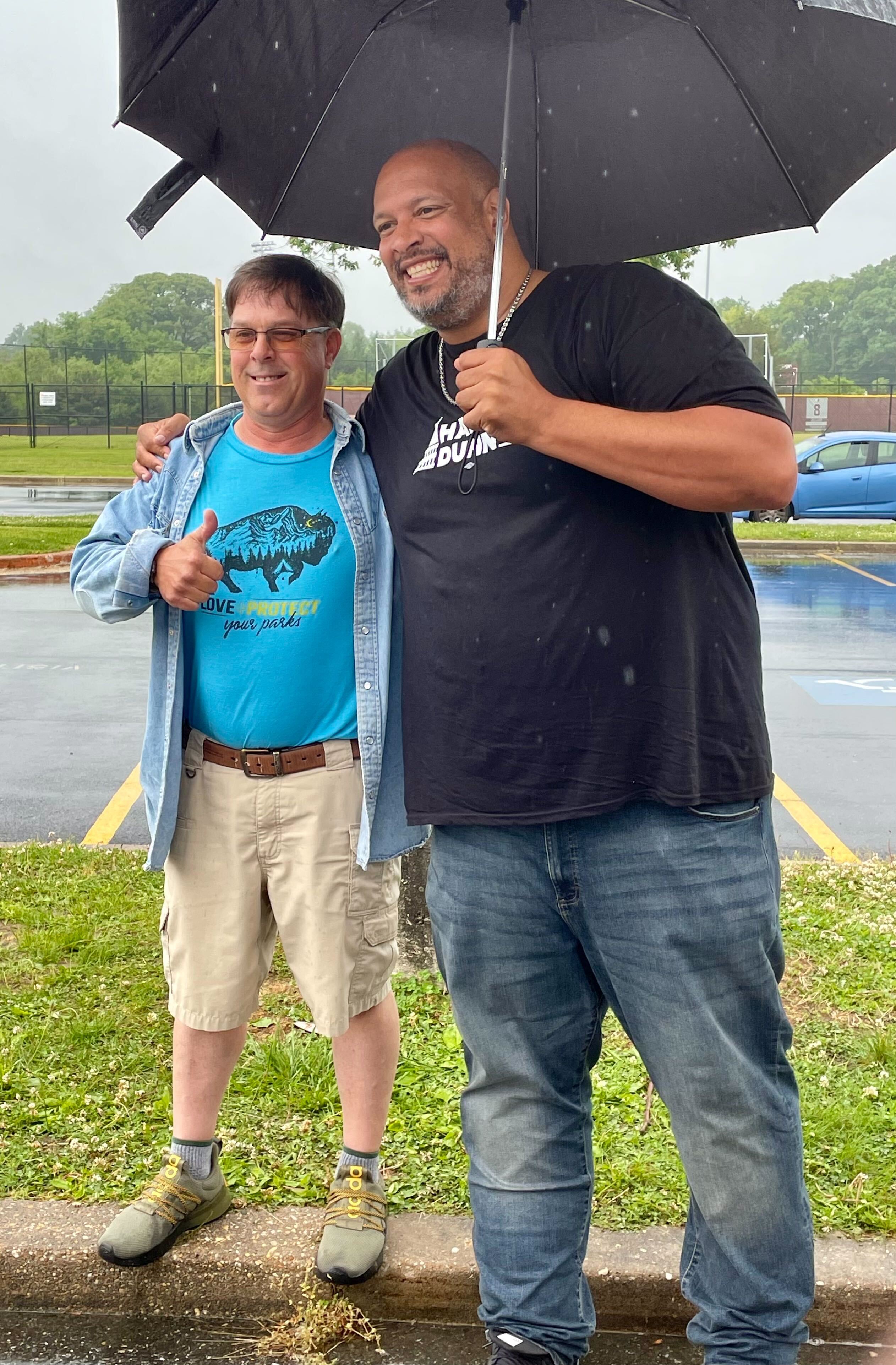 Republican Richard Anthony of Cape St. Claire poses for a picture outside Broadneck High School on May 14, 2024, with Harry Dunn, a Democrat running to represent Maryland’s 3rd Congressional District. (Brenda Wintrode/The Baltimore Banner)