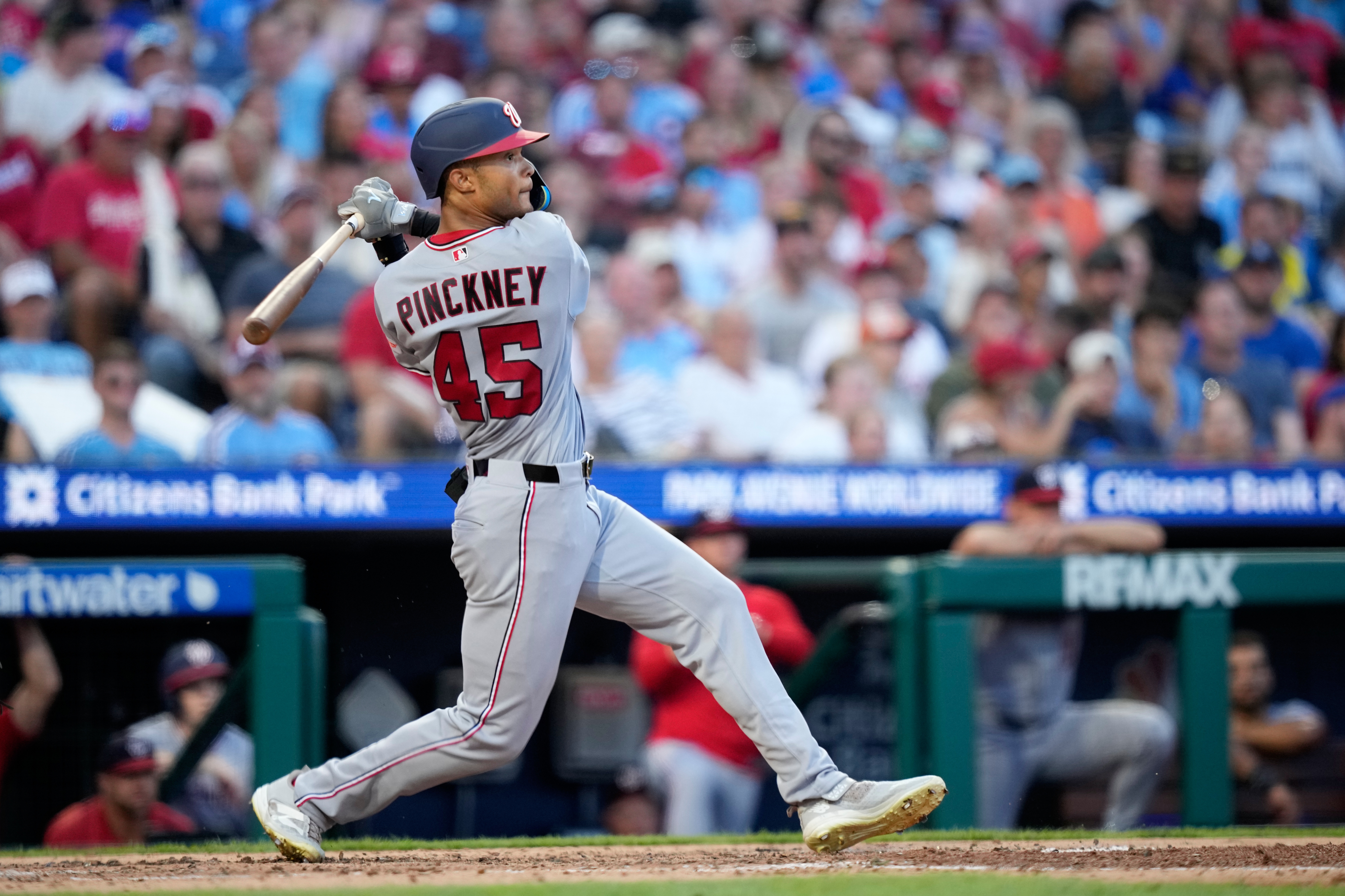 Washington Nationals' Andrew Pinckney follows through after hitting a home run against Philadelphia Phillies pitcher Cristopher Sánchez during the fourth inning of a baseball game Thursday, Aug. 6, 2026, in Philadelphia. (AP Photo/Matt Slocum)