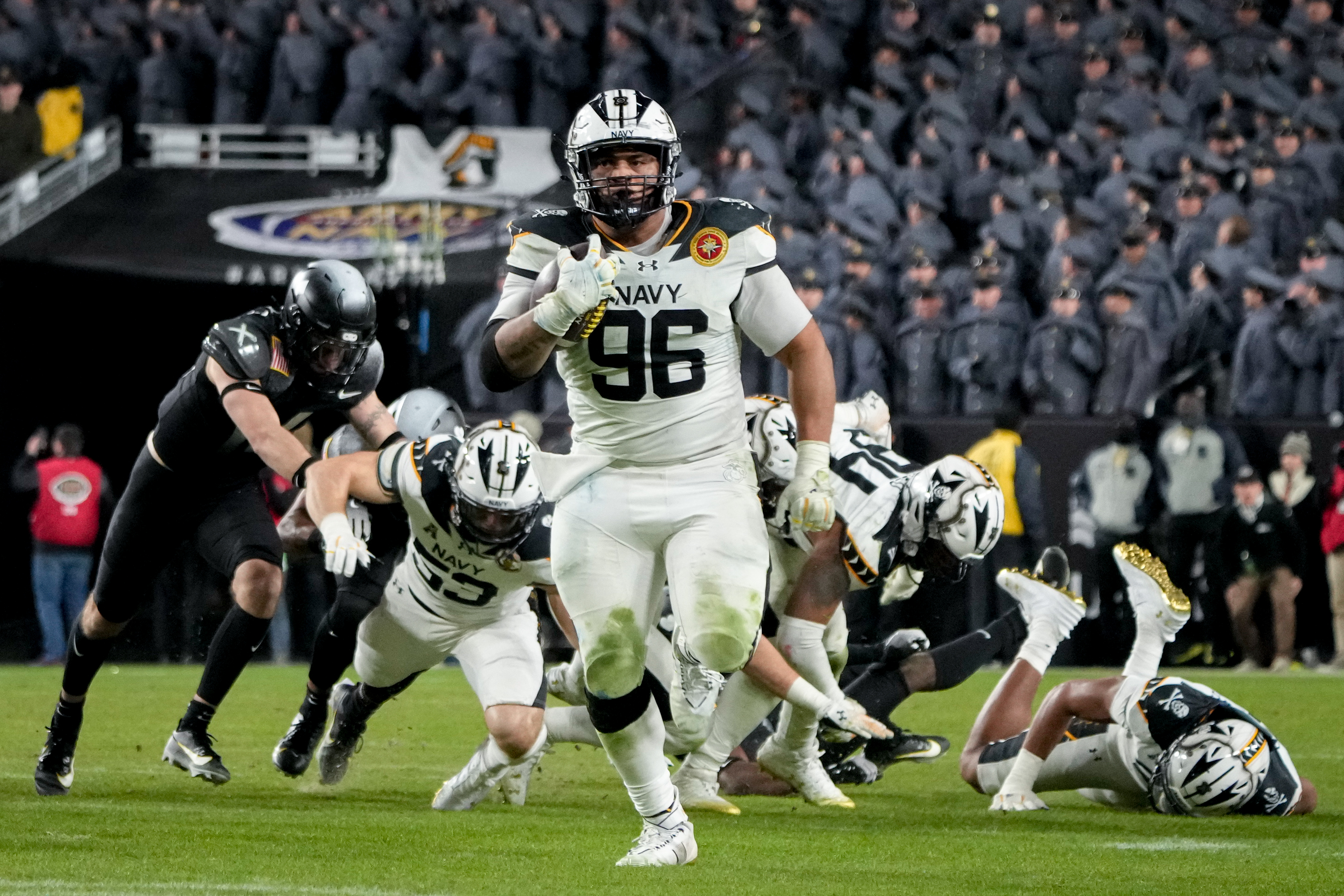 Navy nose tackle Landon Robinson (96) rushes forward on a fake punt attempt during the 125th Annual Army-Navy Game held at Northwest Stadium in Landover, Md. on Saturday, December 14, 2024.