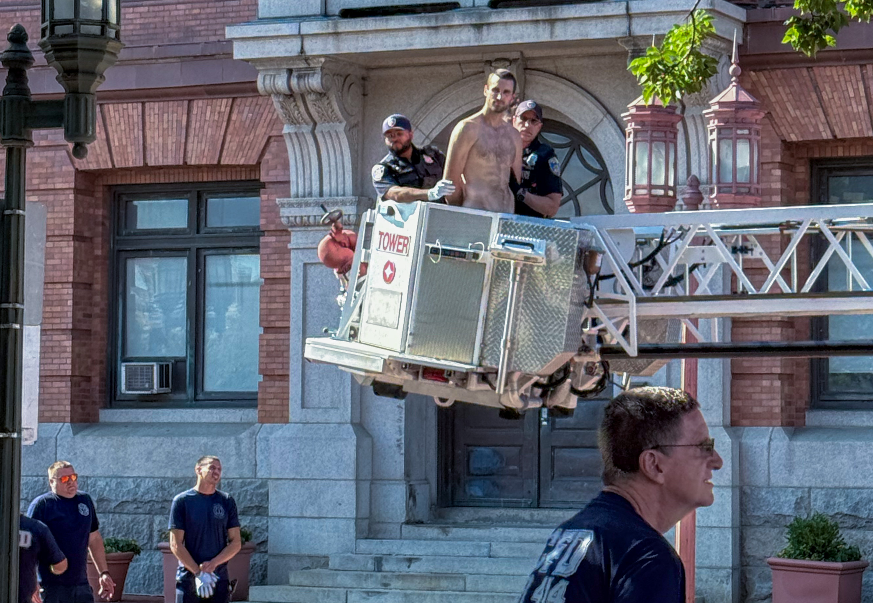Police remove naked performance artist from former Columbus statue pedestal at Inner Harbor