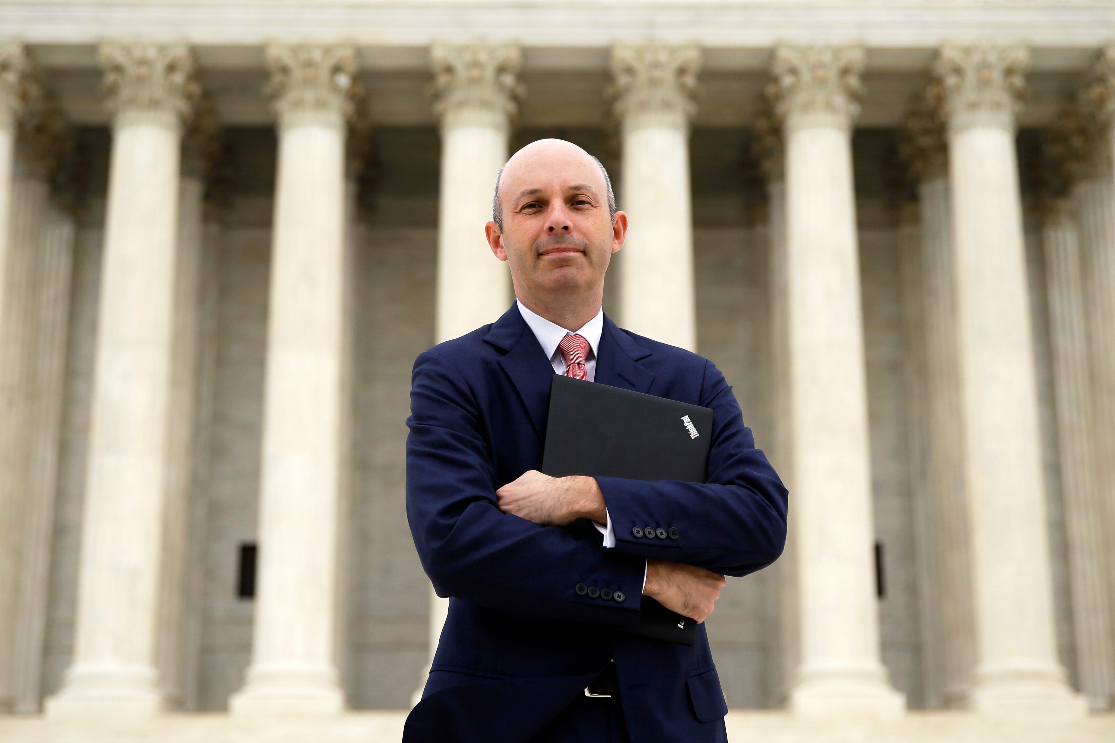Tom Goldstein, who writes SCOTUSblog.com, poses for a photograph in front of the Supreme Court, Oct. 31, 2013, in Washington.