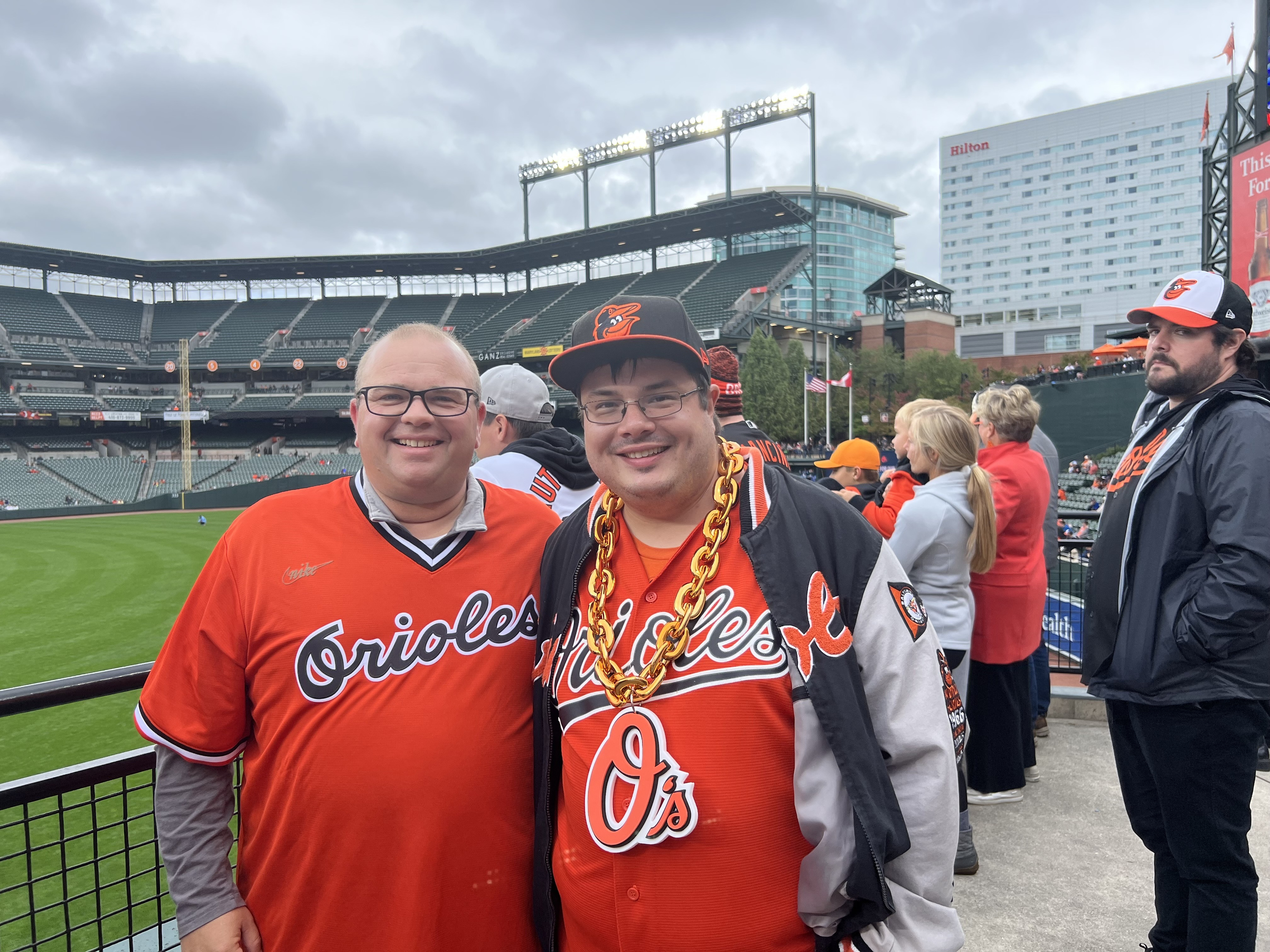 Fans wearing Baltimore Orioles' Trey Mancini jerseys watch the