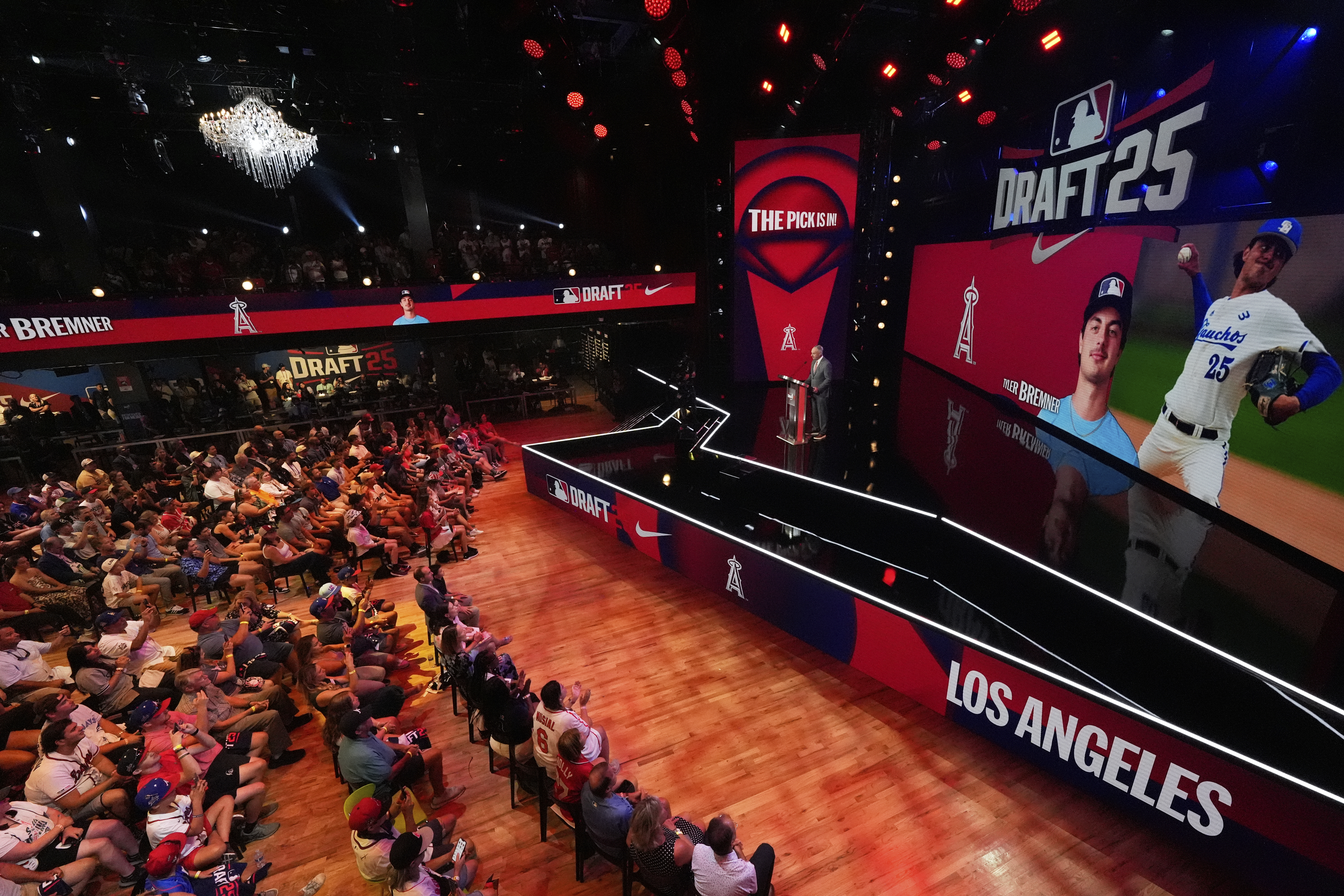 Fans gather to watch the first round of the MLB baseball draft Sunday, July, 13, 2025 in Atlanta.