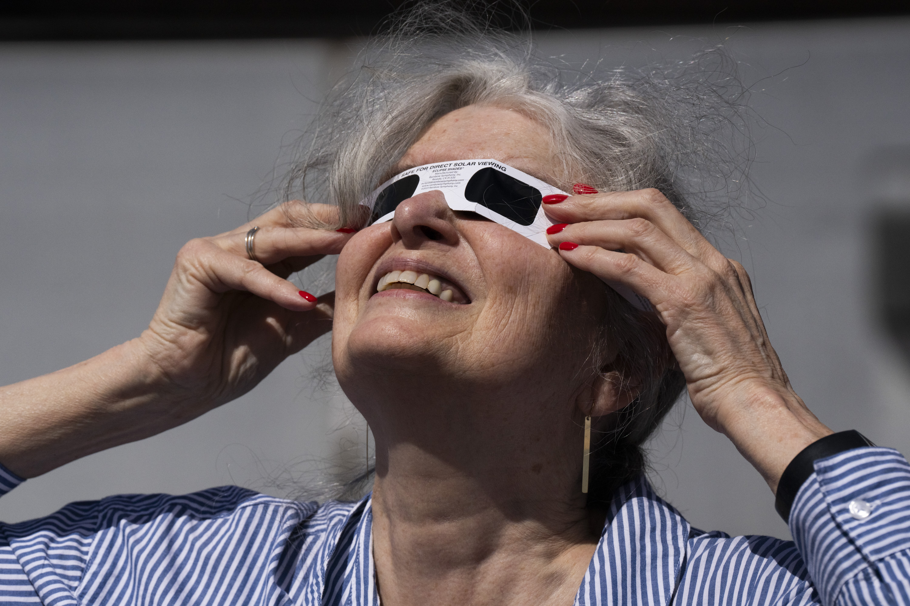 Skies darken as Marylanders look up for partial solar eclipse