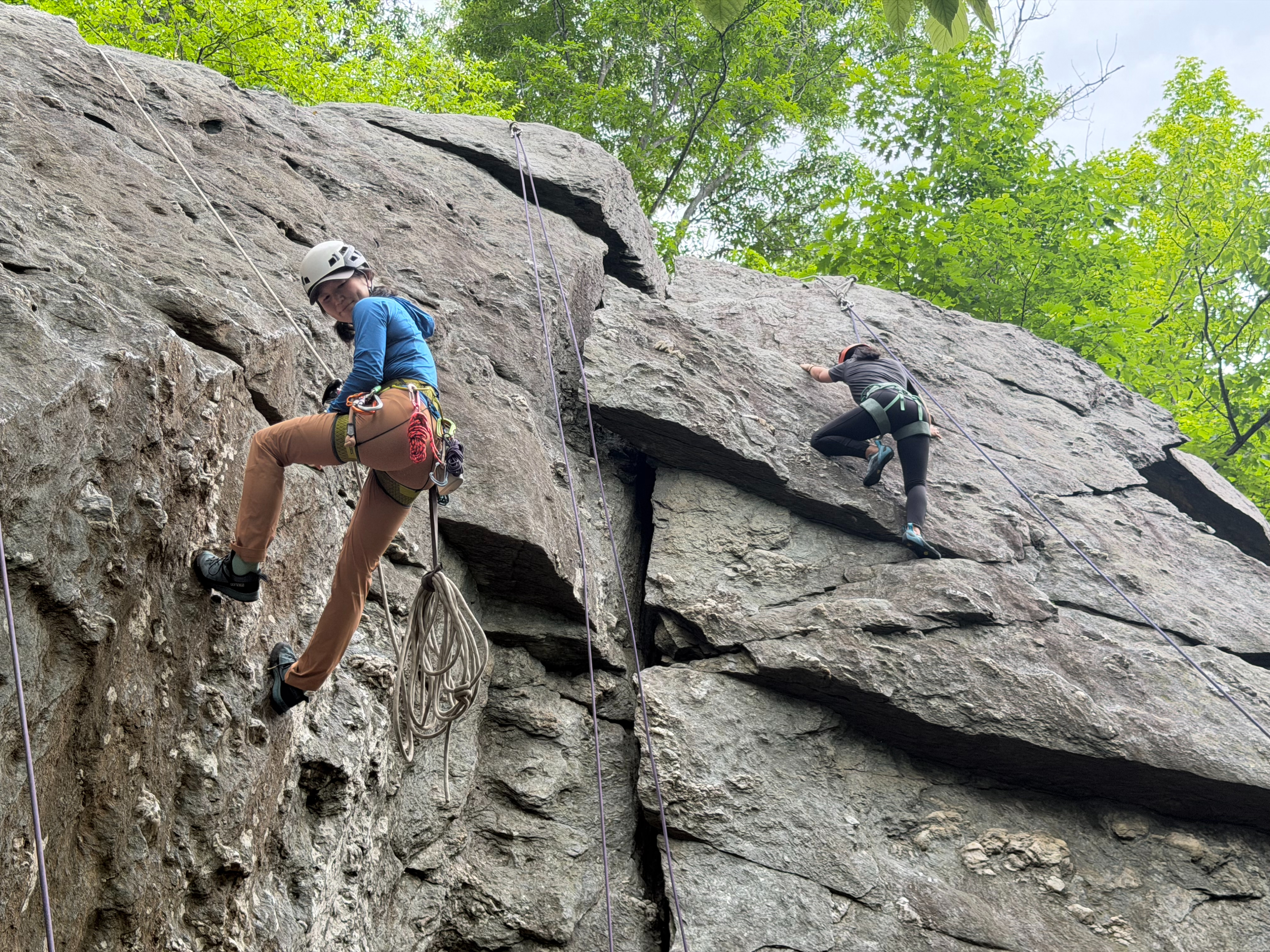 Climbing guide Eunny Jang, left, of Rockville-based East Outdoors ascends  50-foot metamorphic rock on May 26, 2026.