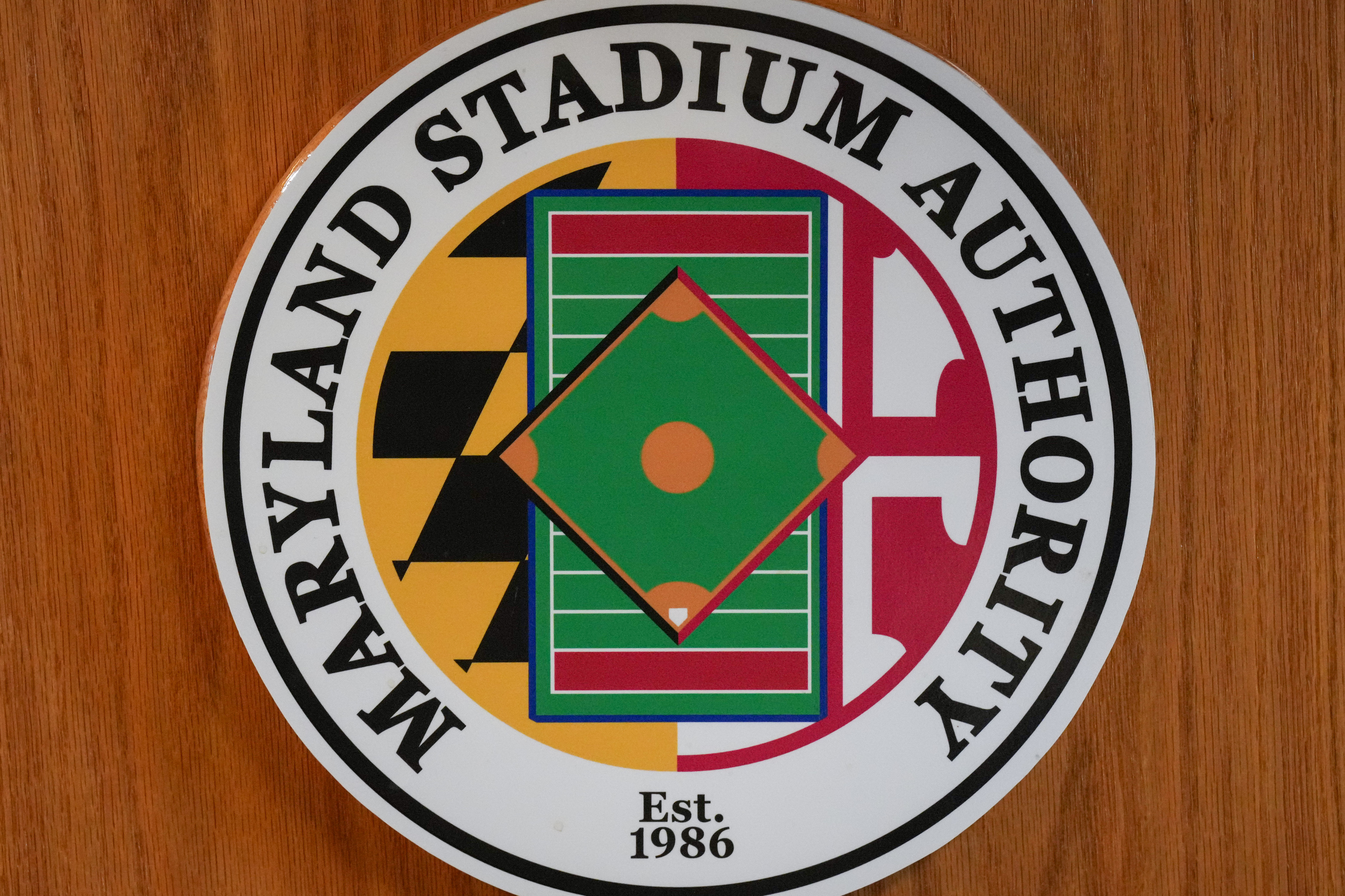 The Maryland Stadium Authority logo is seen on a lectern inside the Camden Yards warehouse boardroom on Monday, December 18, 2023.