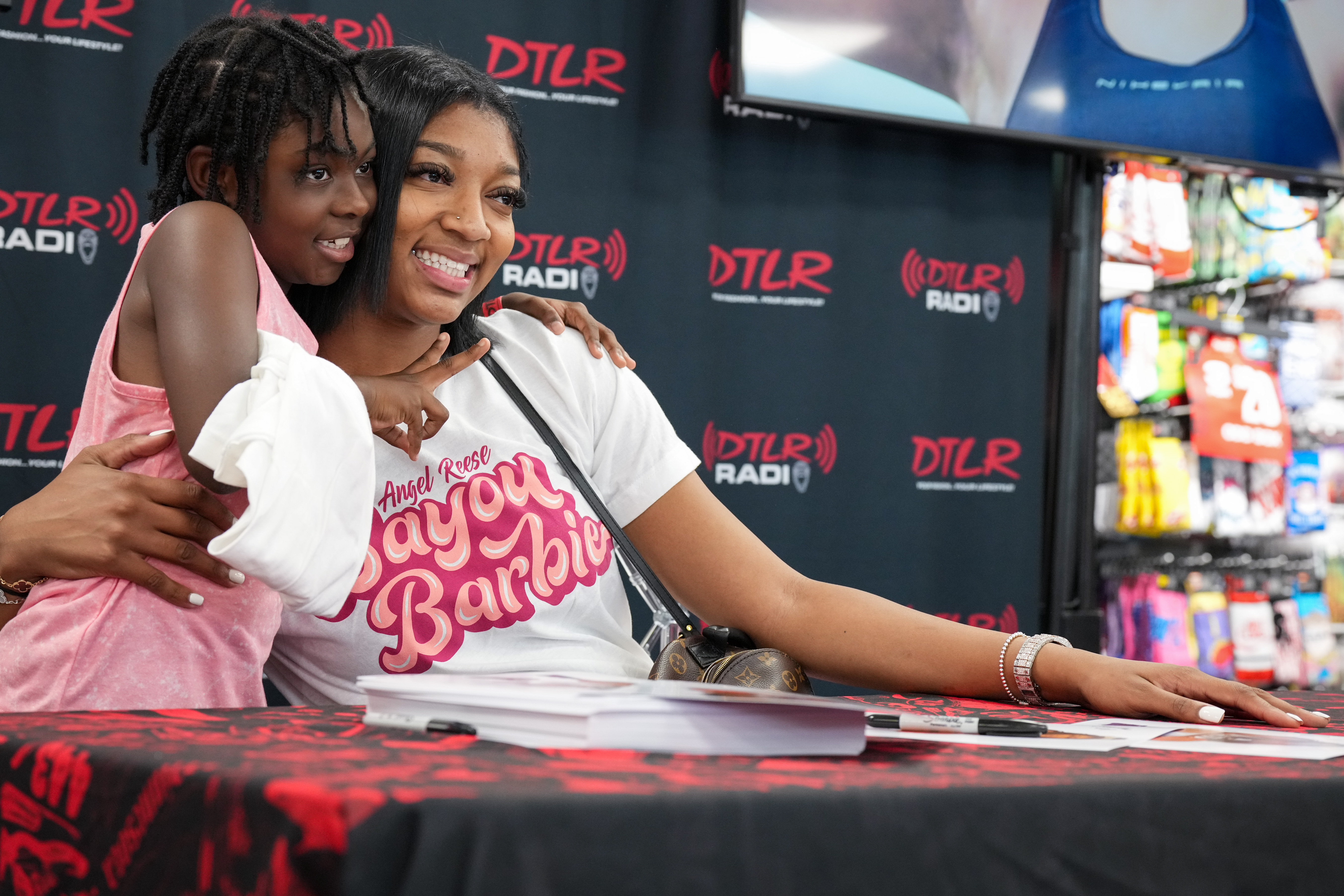 Angel Reese greets fans, raises money for scholarships at DTLR event - The  Baltimore Banner