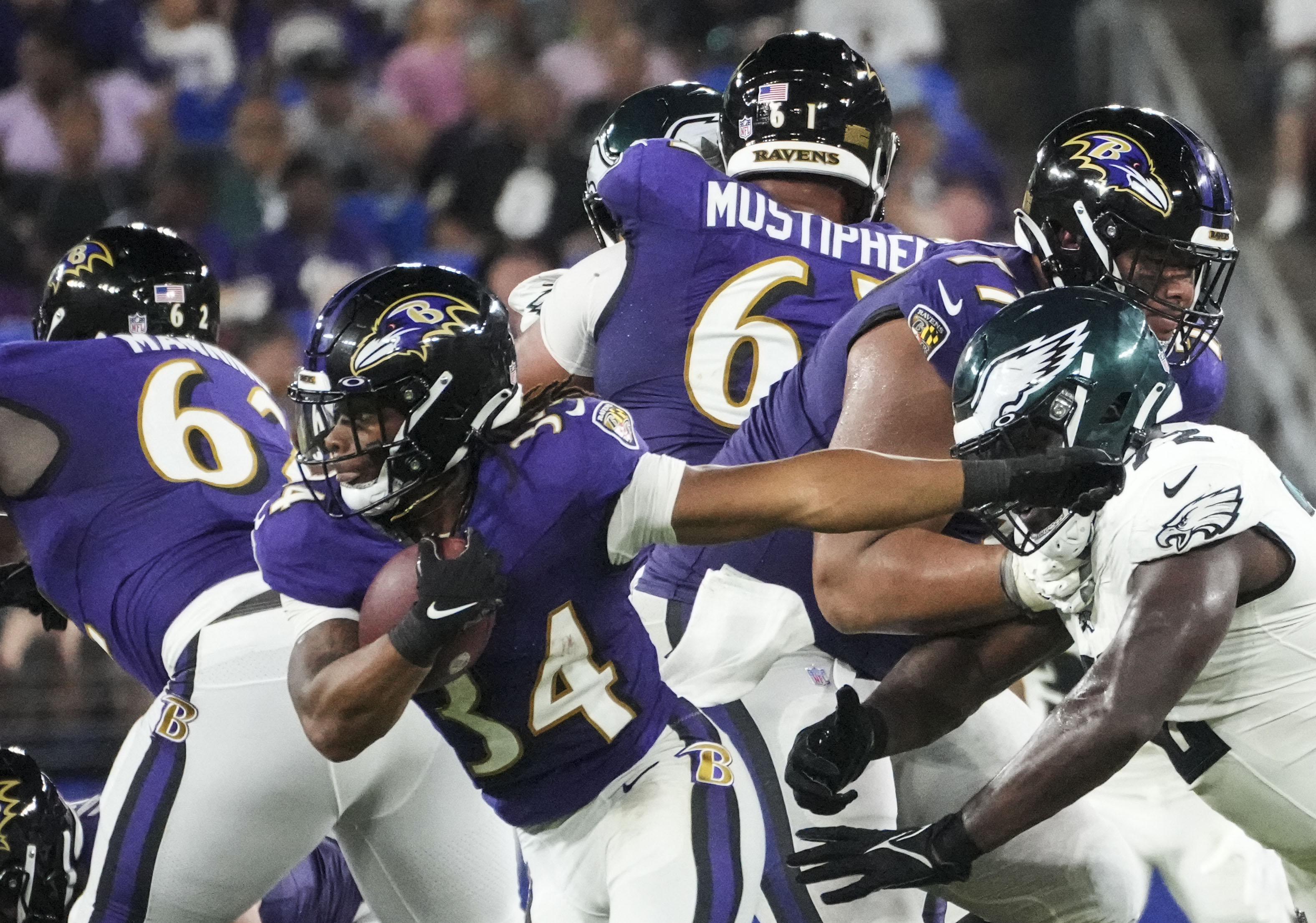 Jeremy Lucien of the Baltimore Ravens walks through the tunnel